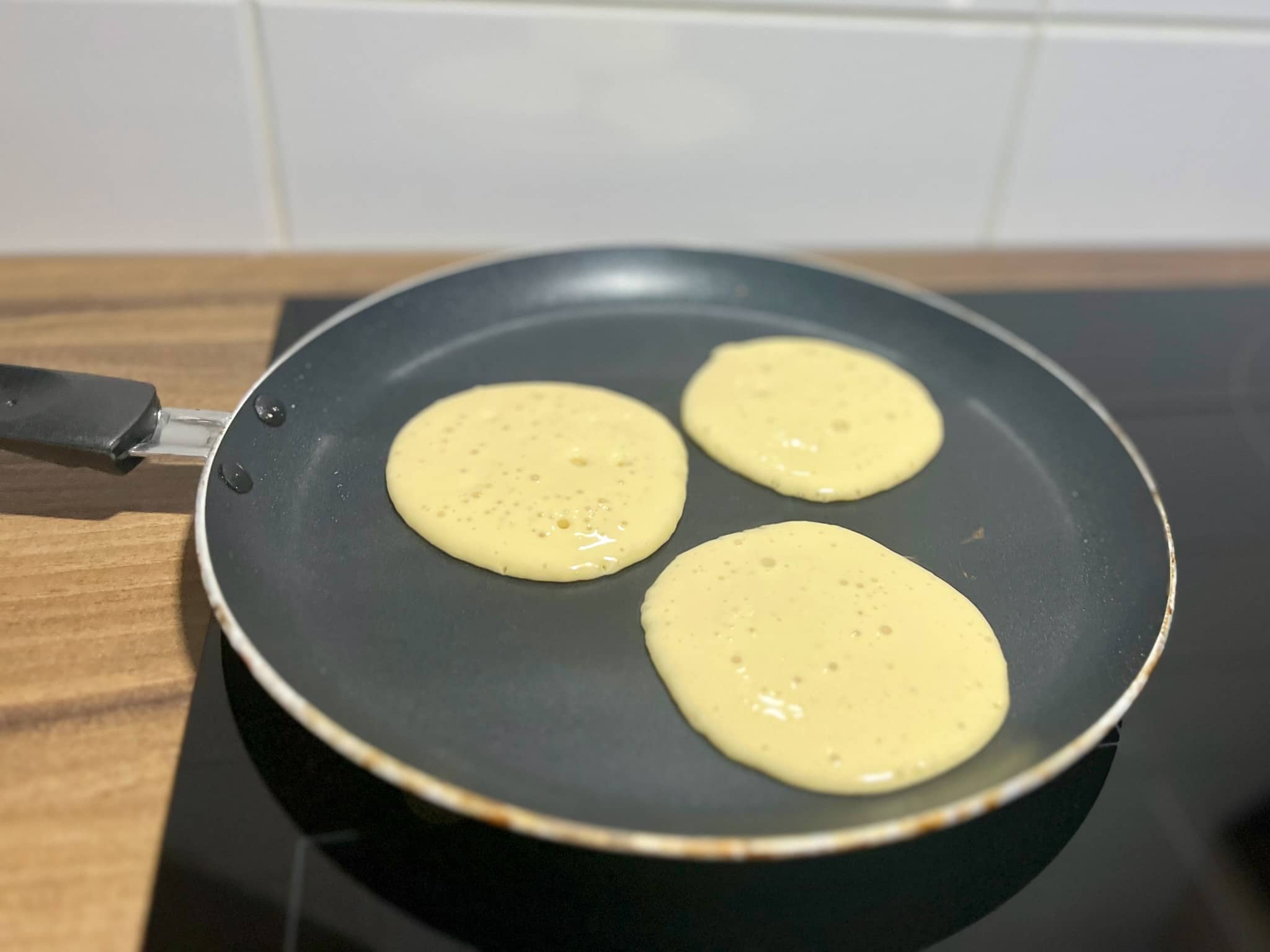Pancaked frying on a pan on one side