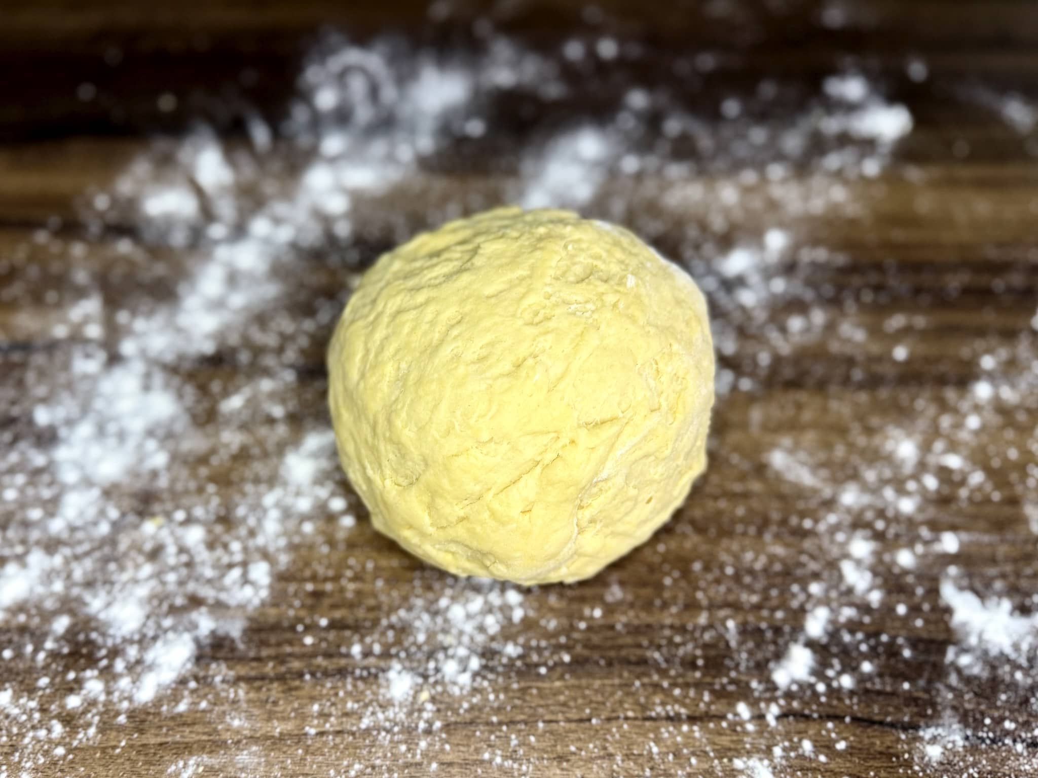 A nicely kneaded dough ball ready for resting before making angel wings