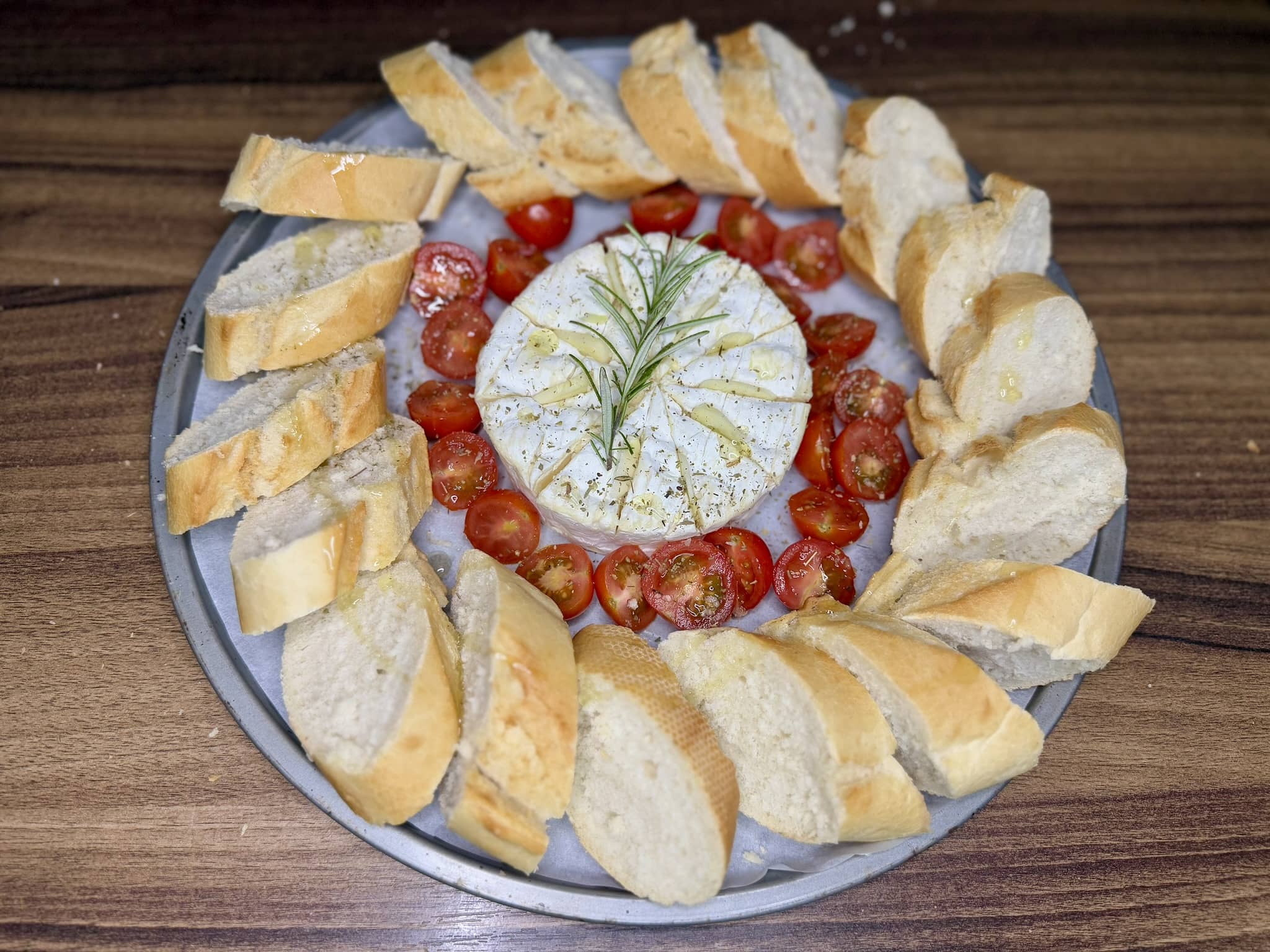 Tray arranged with baguette and drizzled with olive oil, ready to be put into the oven