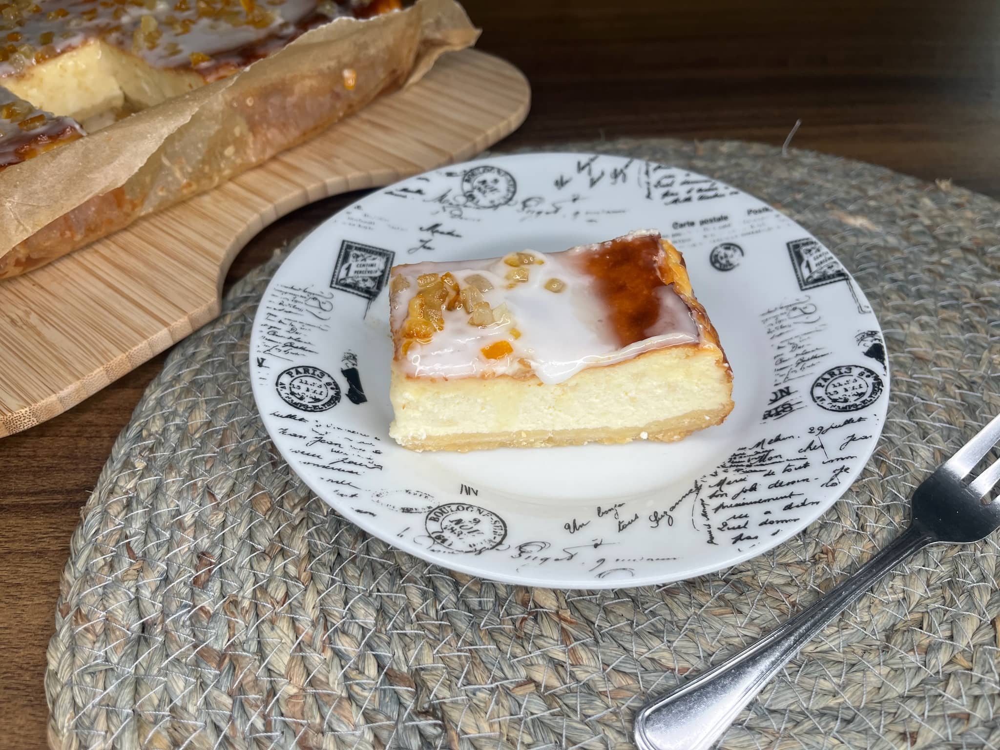 A slice of Baked Lemon Cheesecake on a plate
