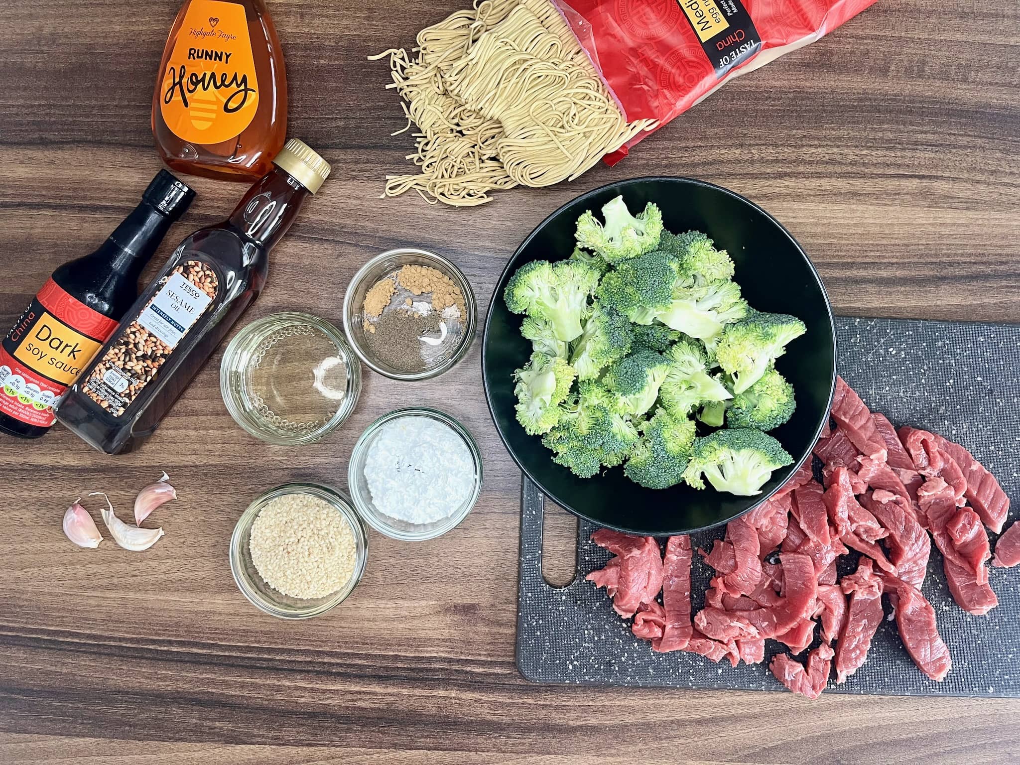 Ingredients for beef and broccoli with egg noodles one-pot dinner on table top