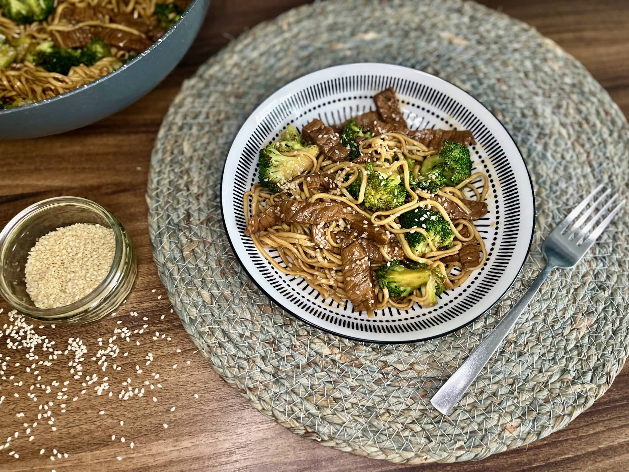 A portion of beef and broccoli with egg noodles in a bowl