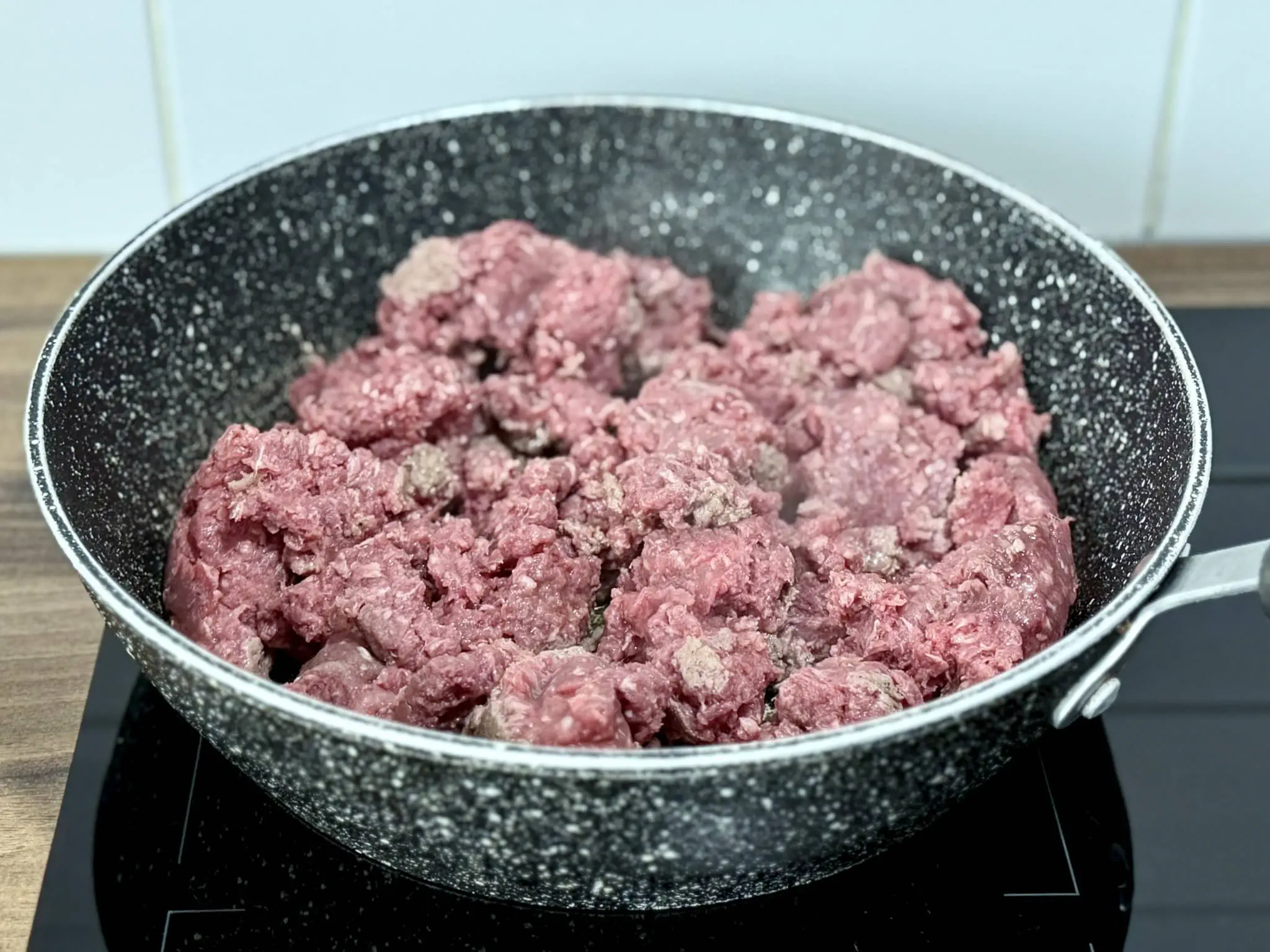 Beef mince frying in a pan