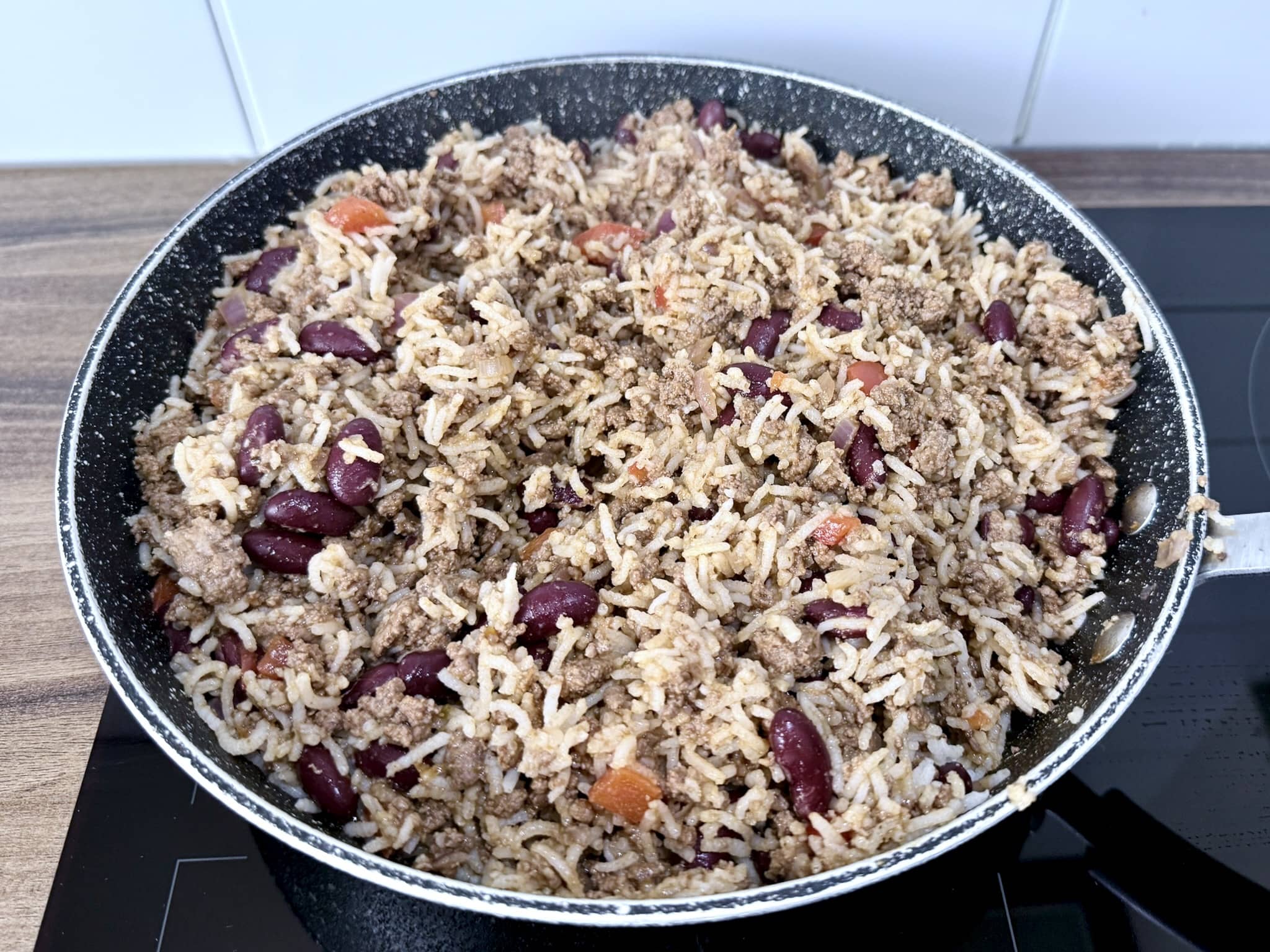 Rice added to the pan and mixed together