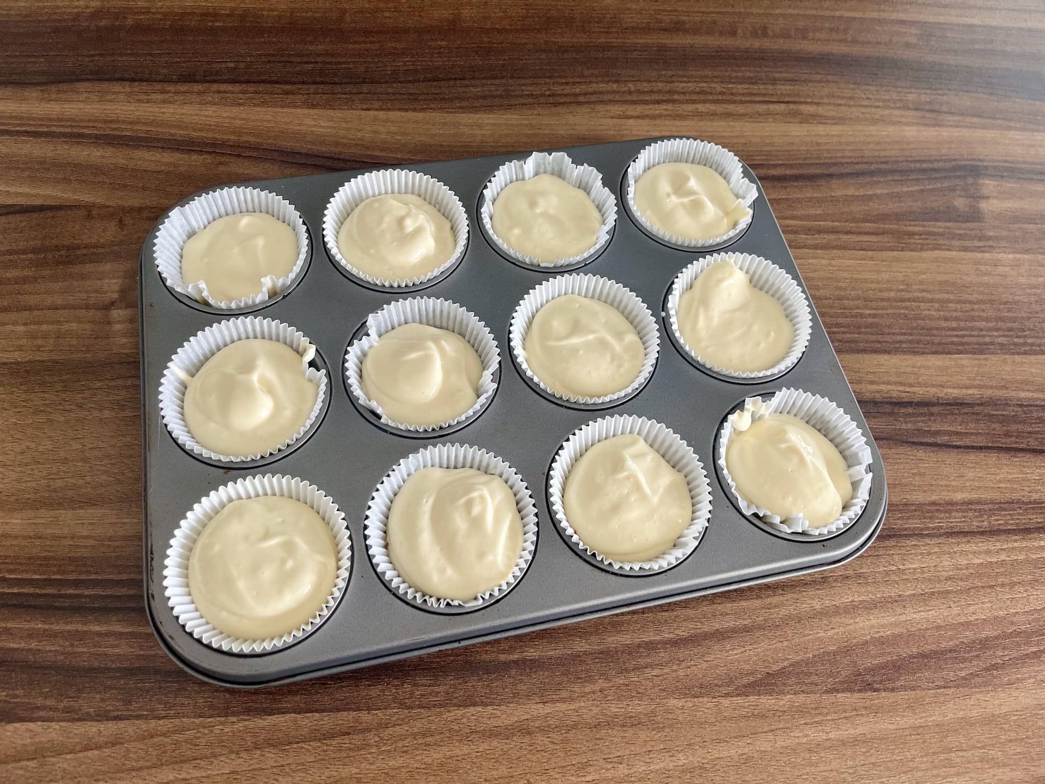 Cupcake cases filled with cheesecake mix