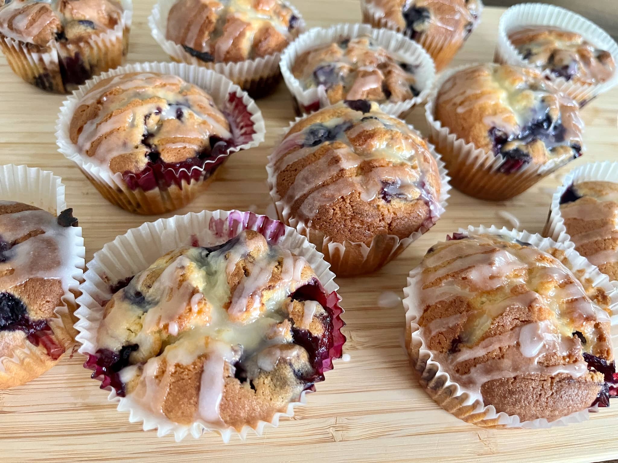 Glazed blueberry muffins on the board
