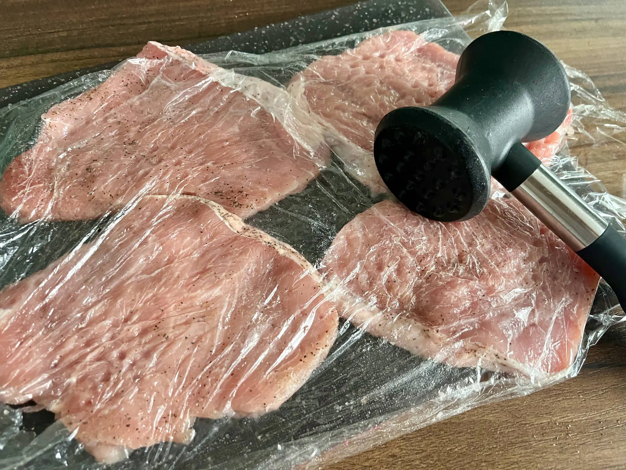 Pork loins covered with cling film