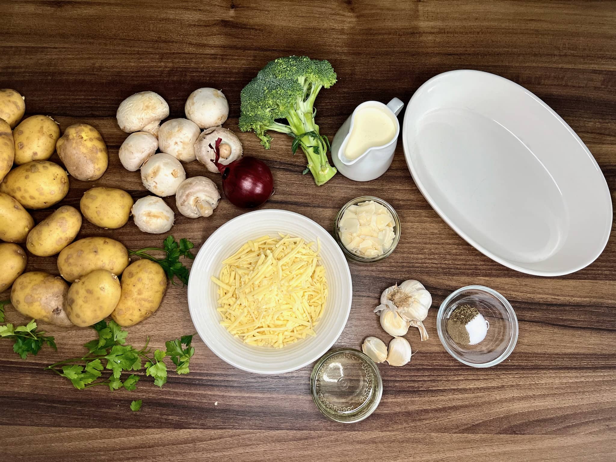 All the ingredients on the tabletop ready to make Broccoli and Mushroom Potato Casserole
