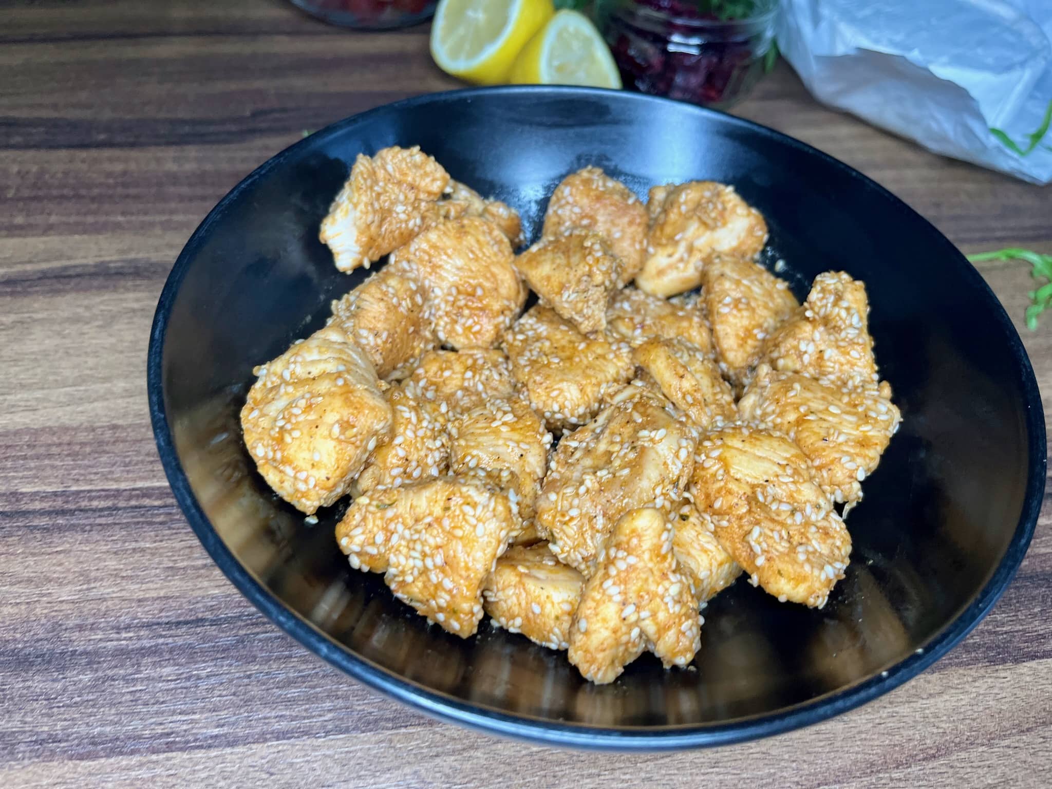 Fried chicken dice covered in sesame seeds