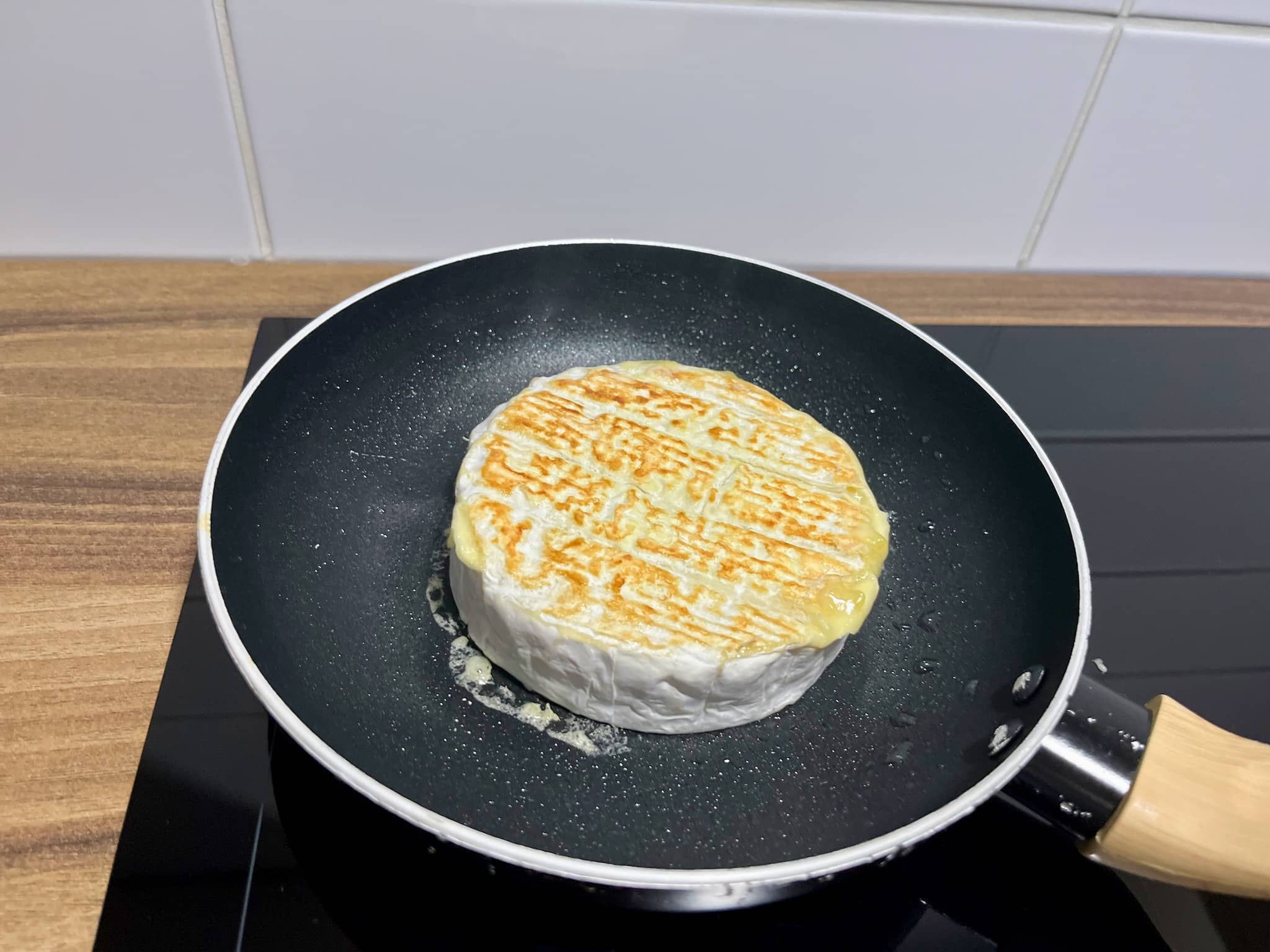 Camembert Cheese frying in a pan