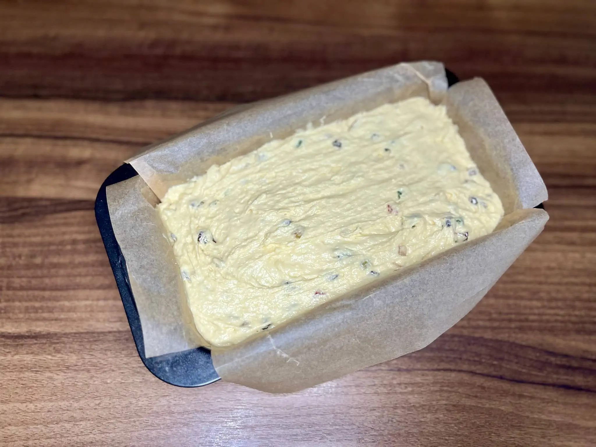 Mixture for Candied Fruit Loaf Cake in a tin ready to be baked