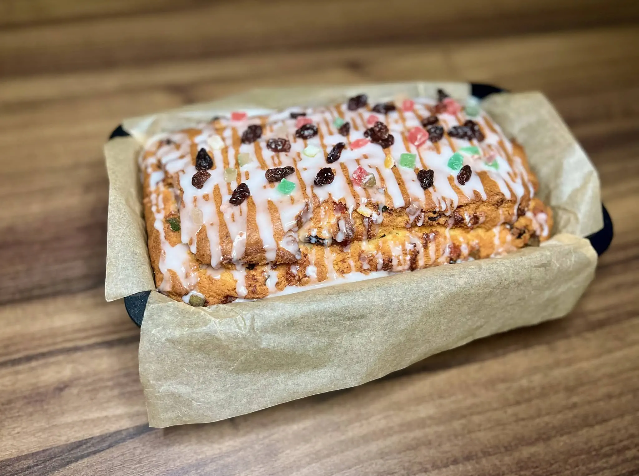 Nicely decorated Candied Fruit Loaf Cake with icing and fruits on top