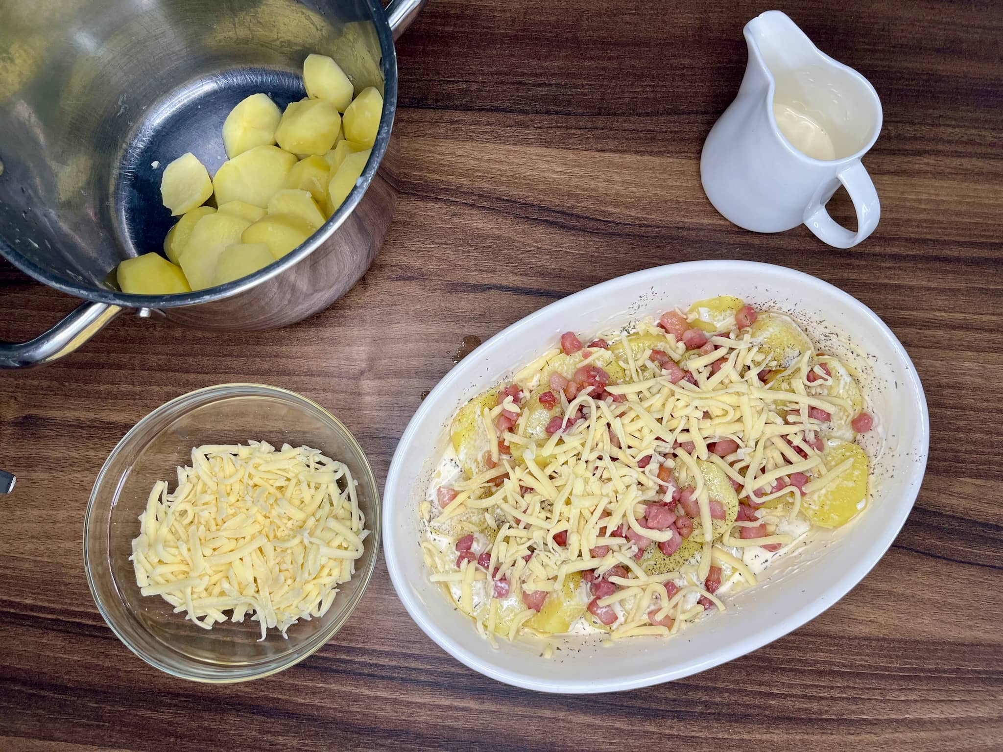 Preparing a dish for Cheesy Baked Potatoes with all ingredients in a dish