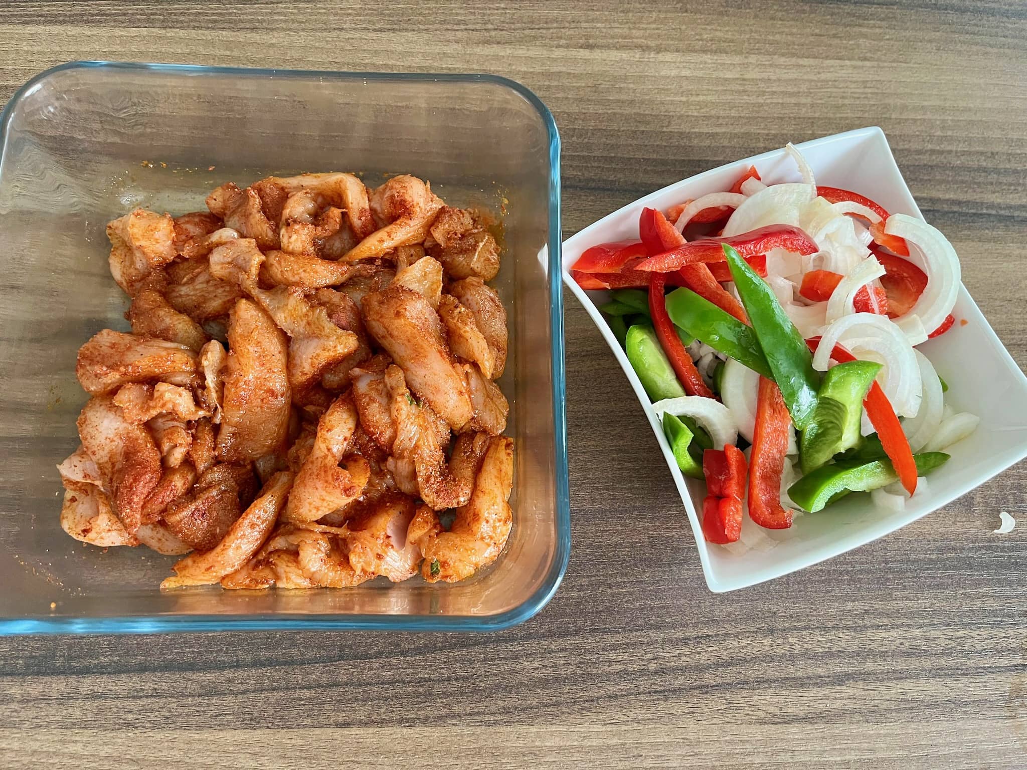 Marinated chicken with sliced onion and peppers