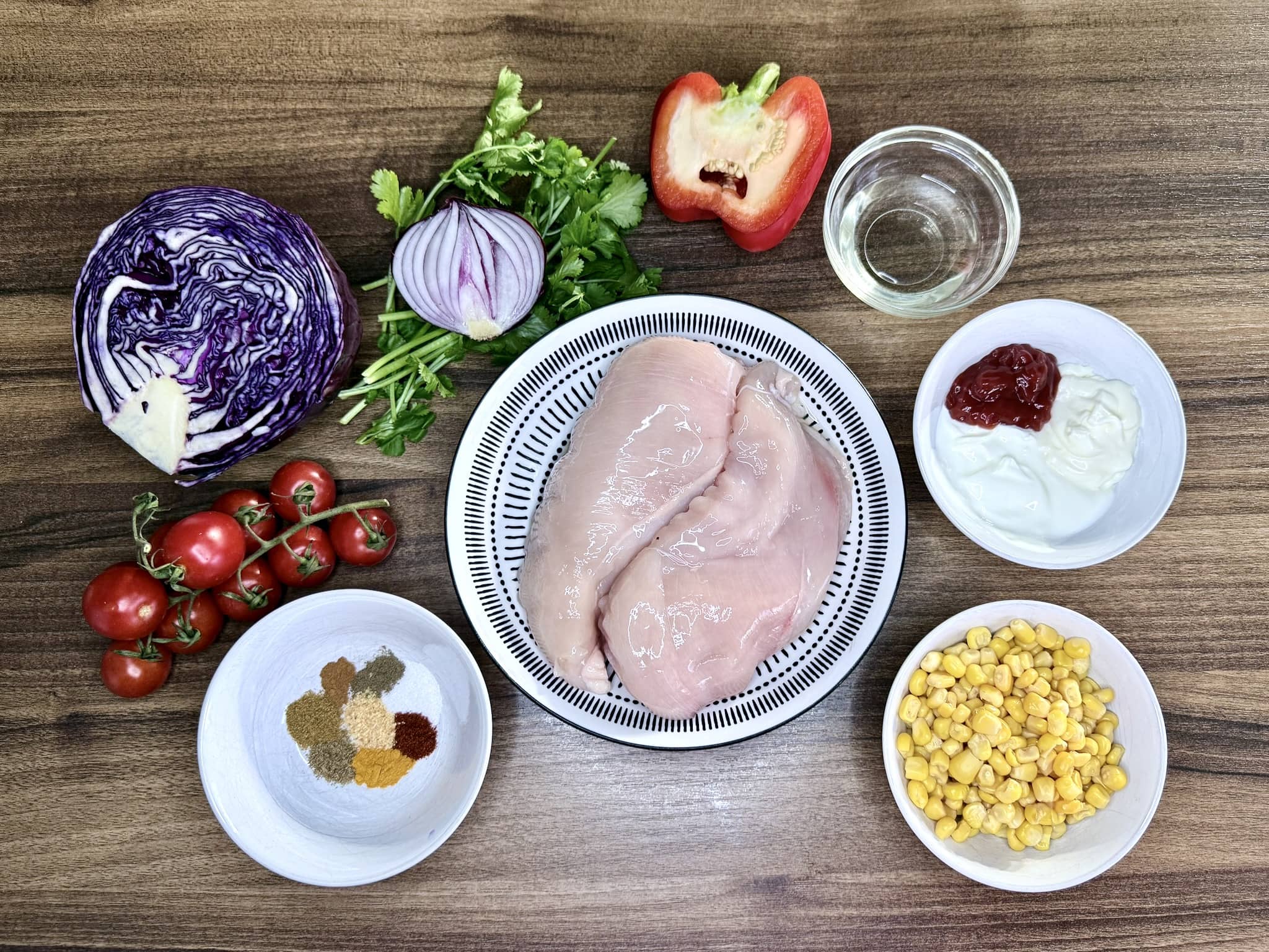 All the ingredients on a tabletop ready to make Chicken Kebab Salad