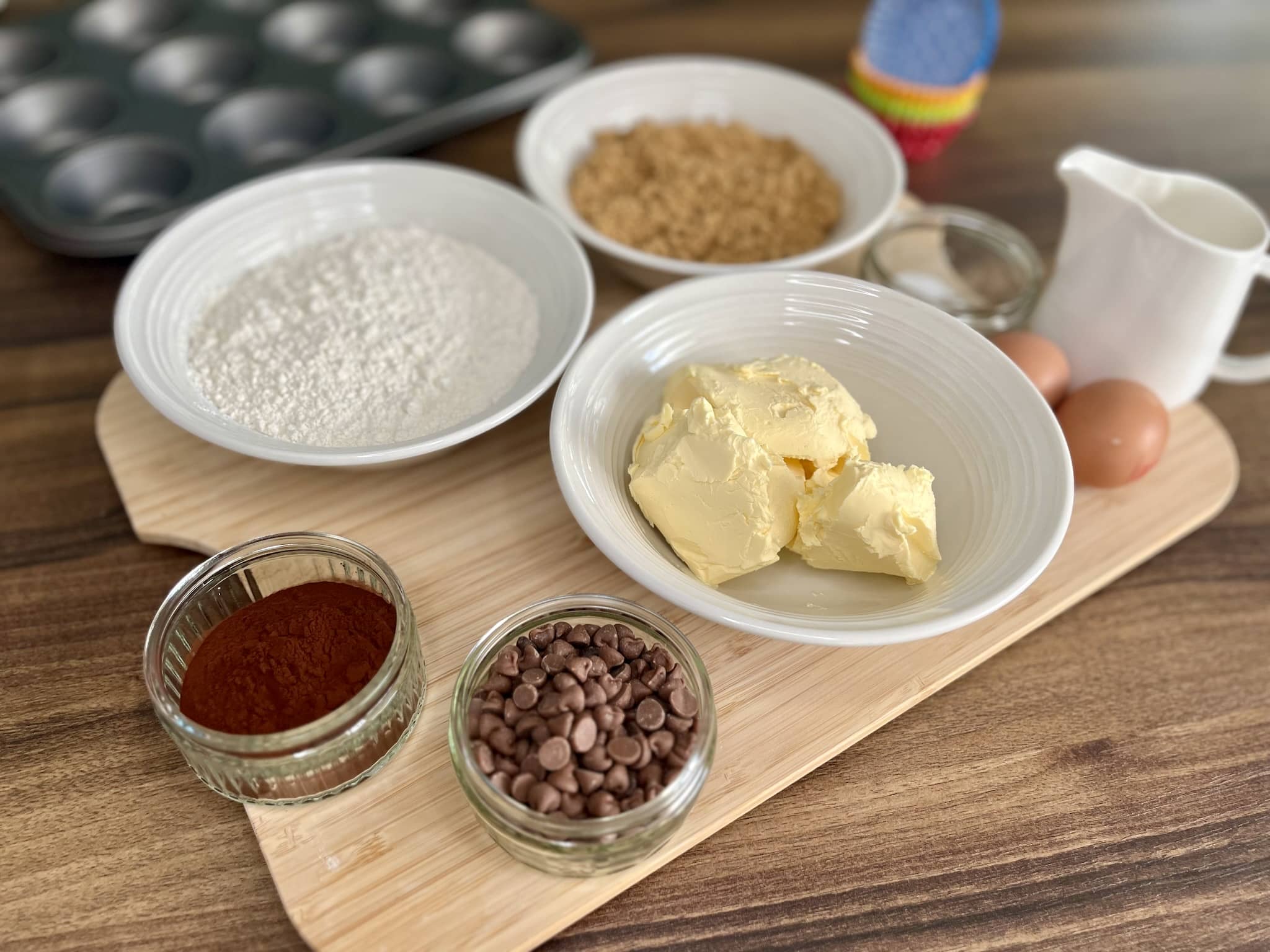 All the ingredients on a tabletop ready to make Chocolate Muffins