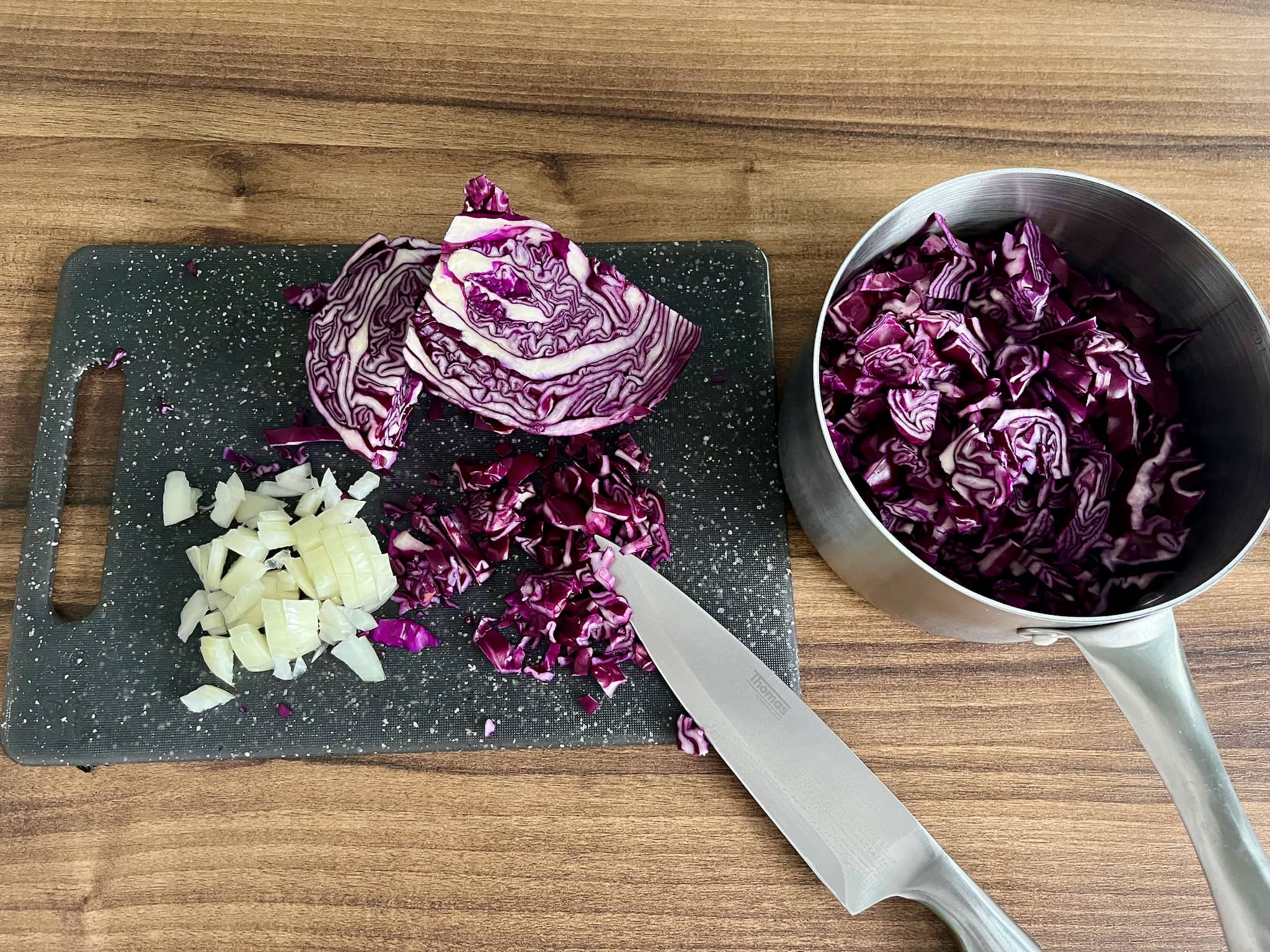 chopped onion and cabbage in a medium pot