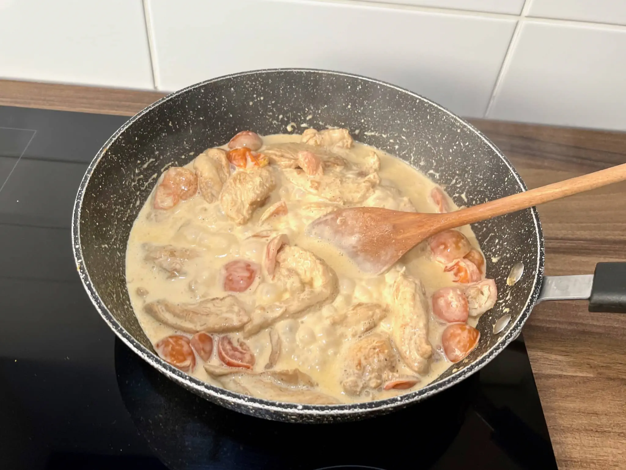 Juicy fried chicken and halved cherry tomatoes, topped with a generous dollop of double cream.
