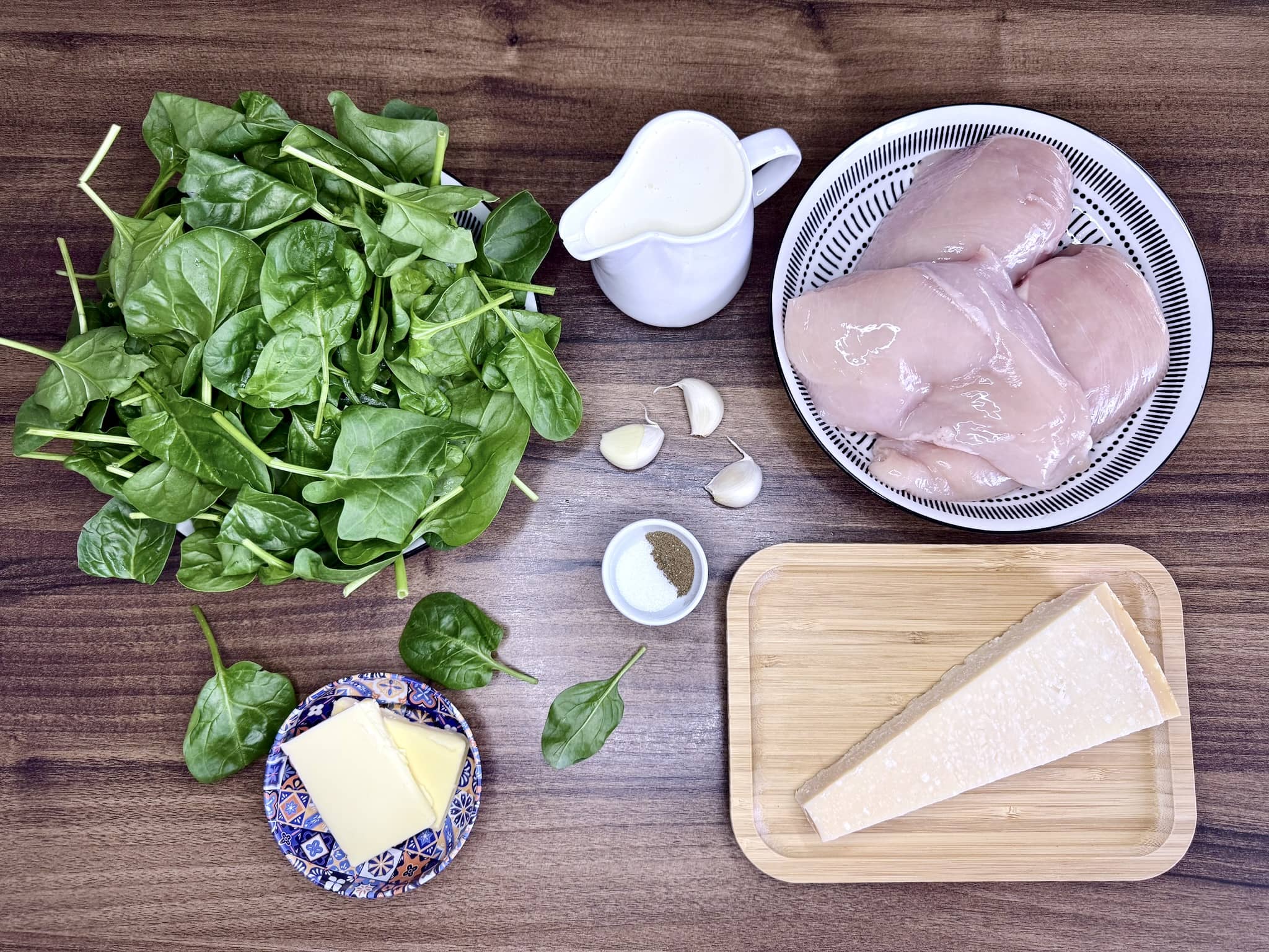 All the ingredients on the worktop ready to make Creamy Garlic & Parmesan Spinach Chicken