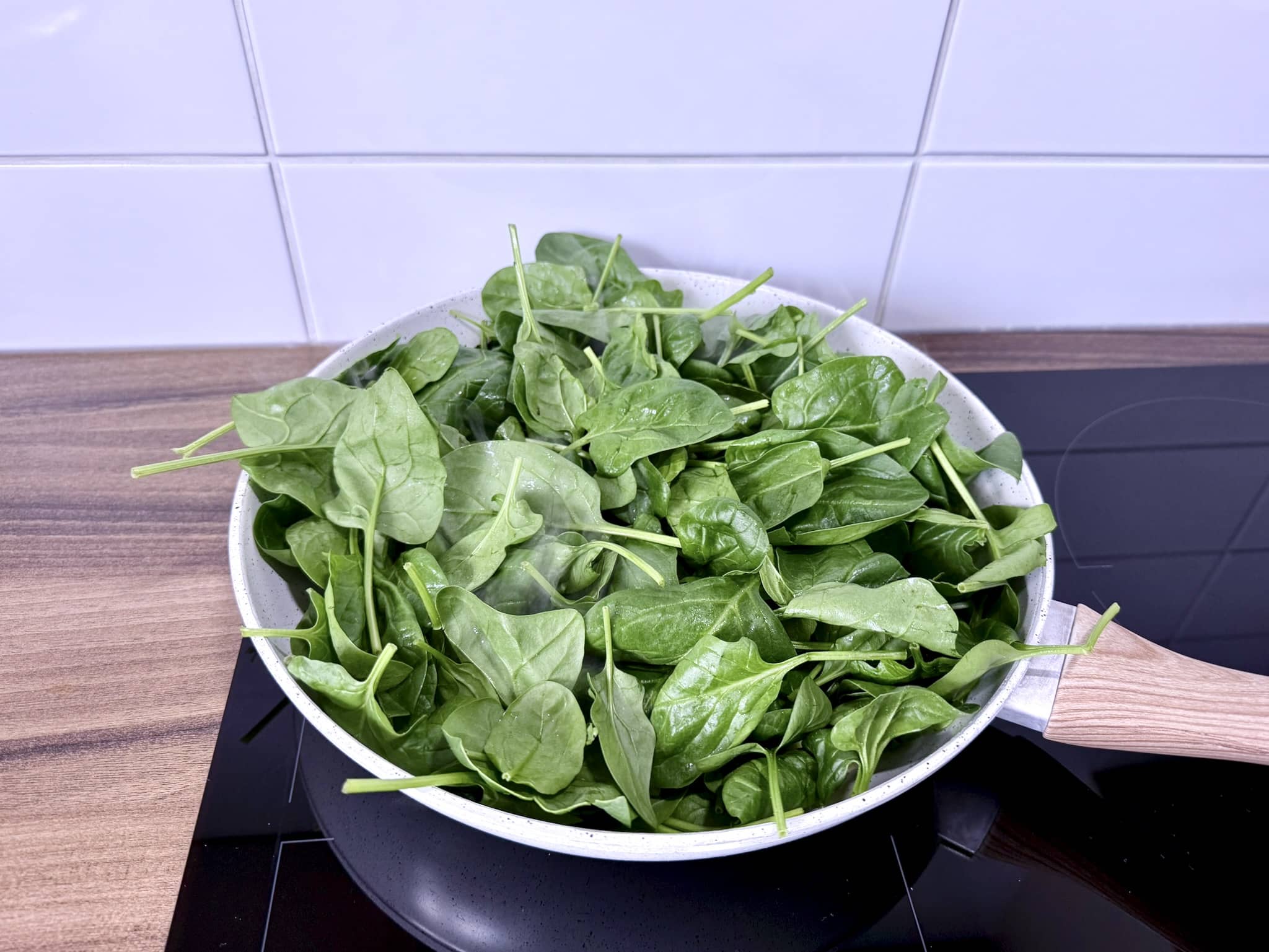 Spinach added to the pan