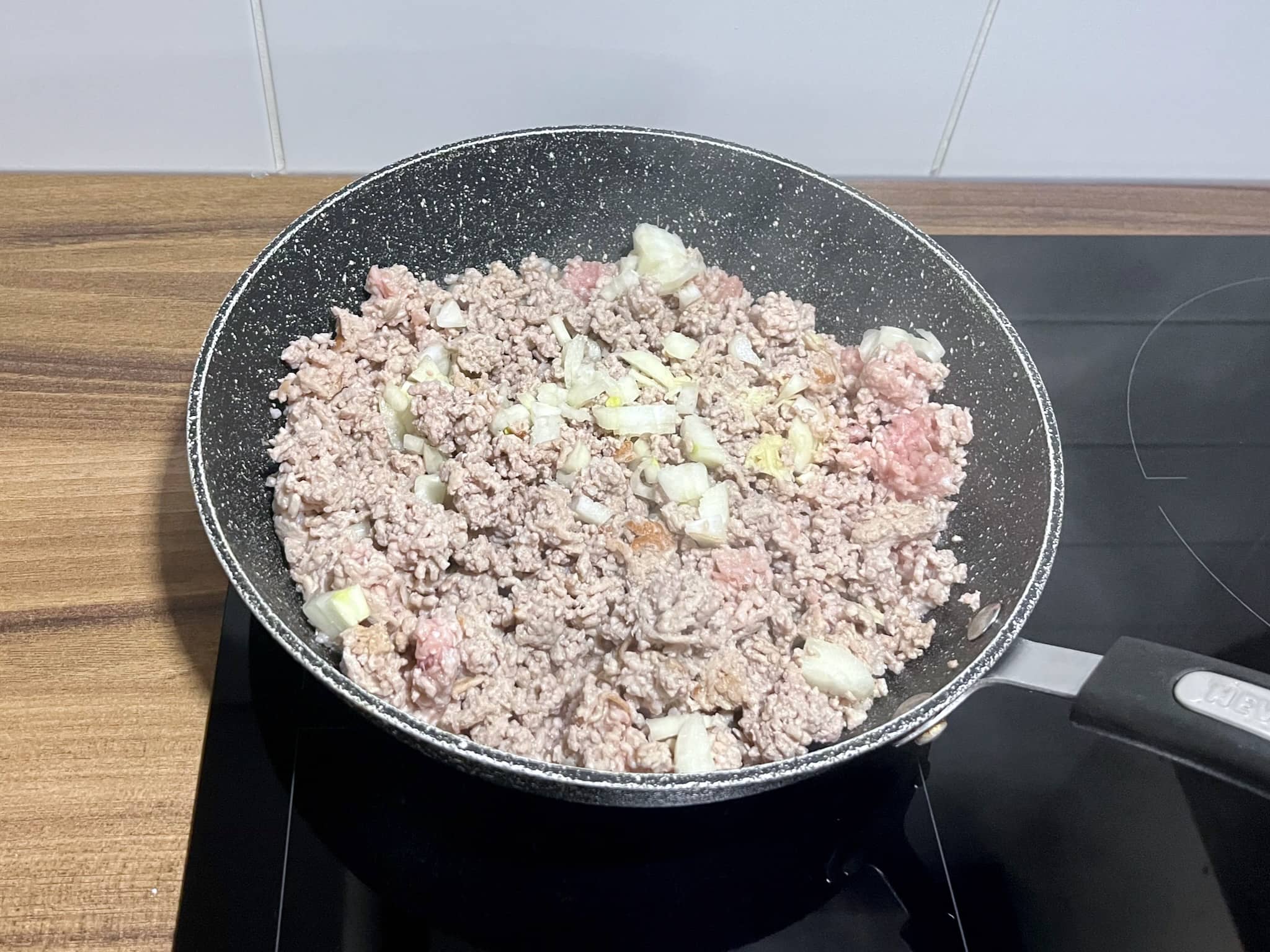 Cooking minced pork with onion and garlic