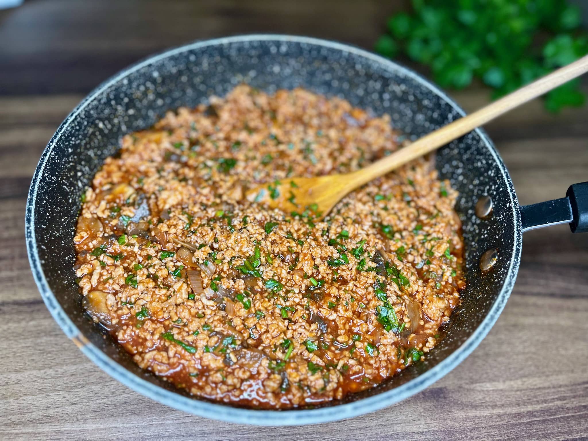 Minced pork and mushrooms with tomato passata and parsley