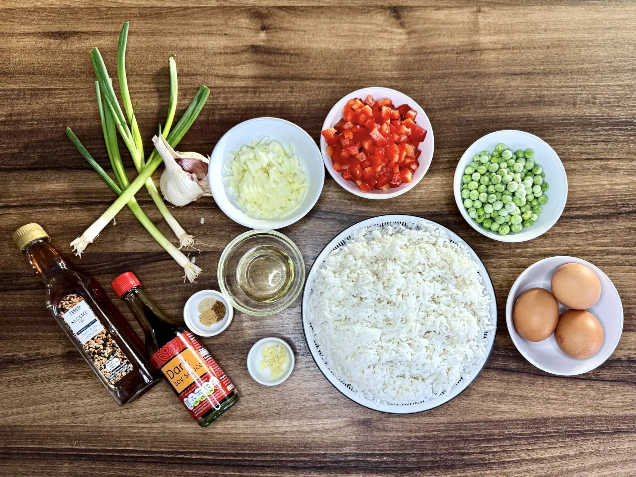 All the ingredients on the table top ready to make Egg Fried Rice