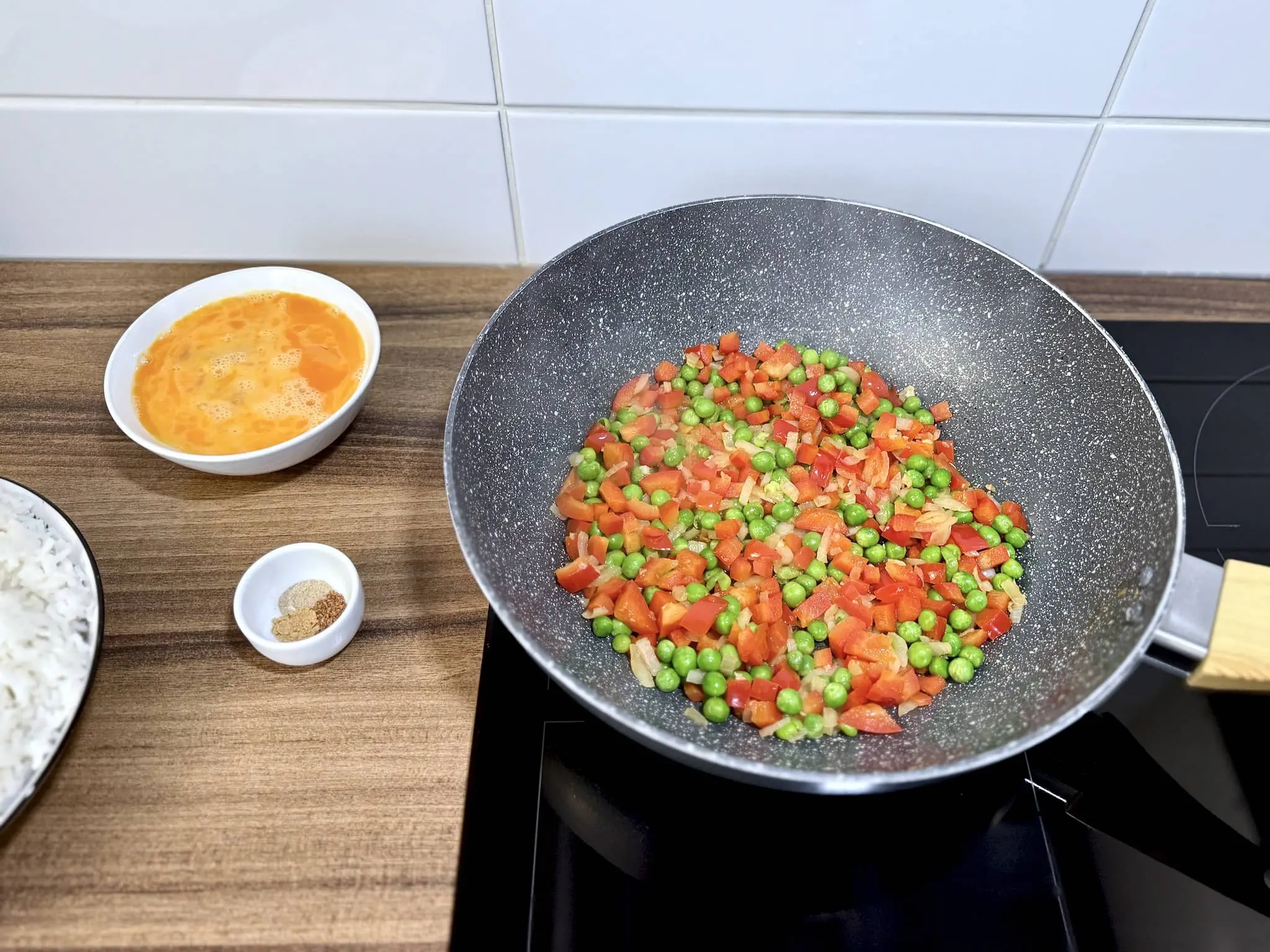 Veggies frying in a pan, ready for the next step