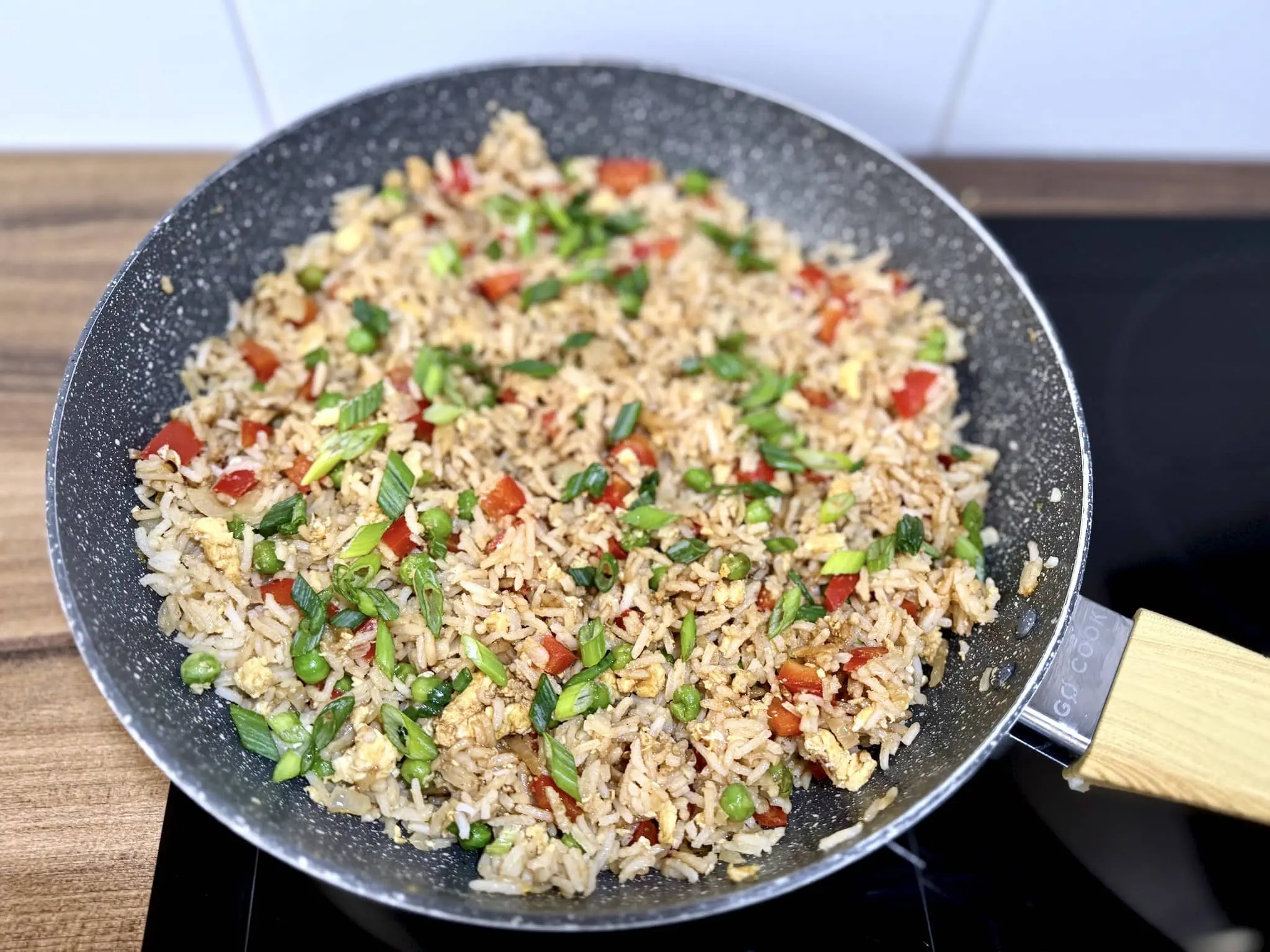 Spring onion added to the pan and mixed with the rest of the ingredients