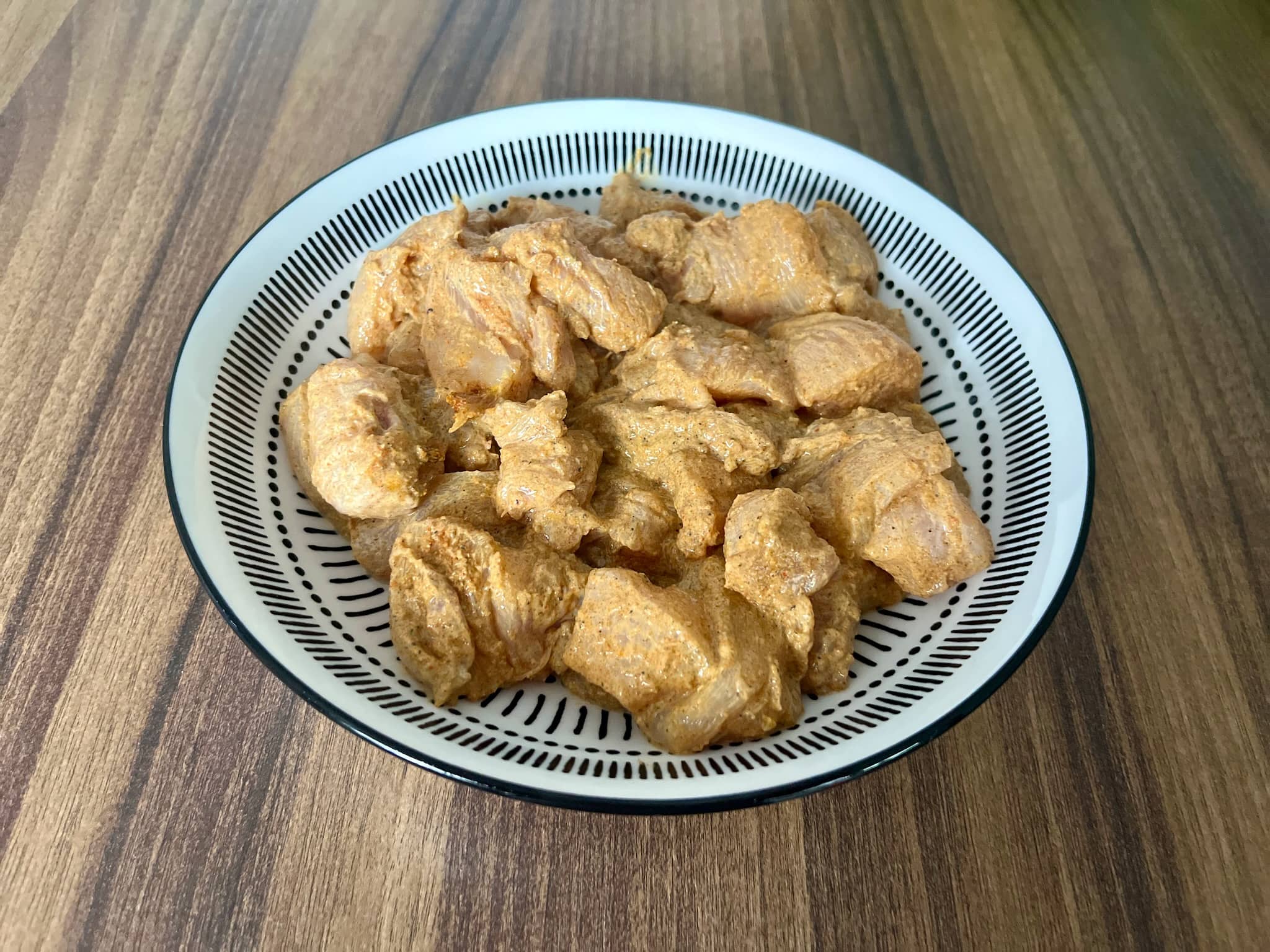 Marinated chicken cubes in a bowl