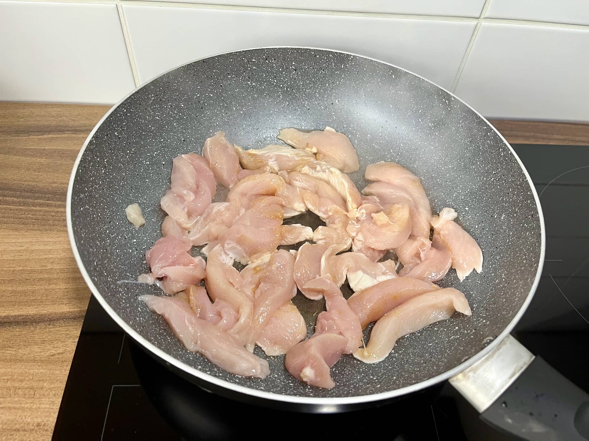 Chicken frying in a pan