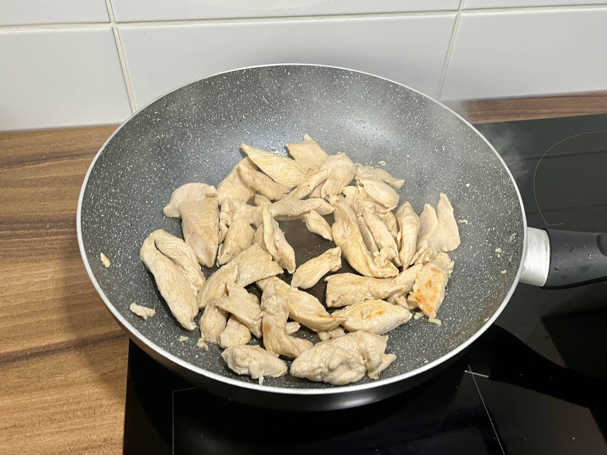 Well-cooked chicken in a pan