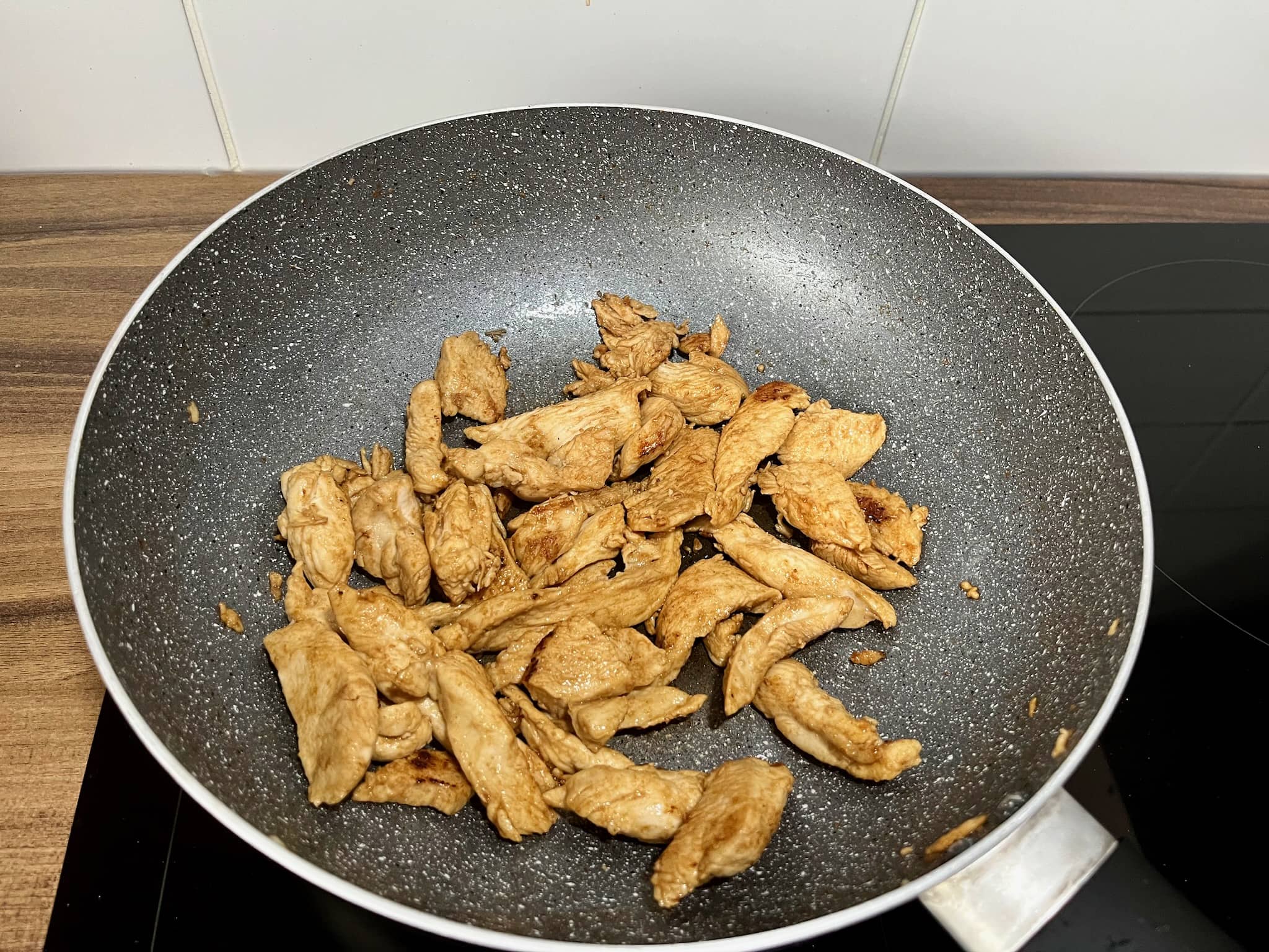 Cooked chicken in a pan with soy sauce