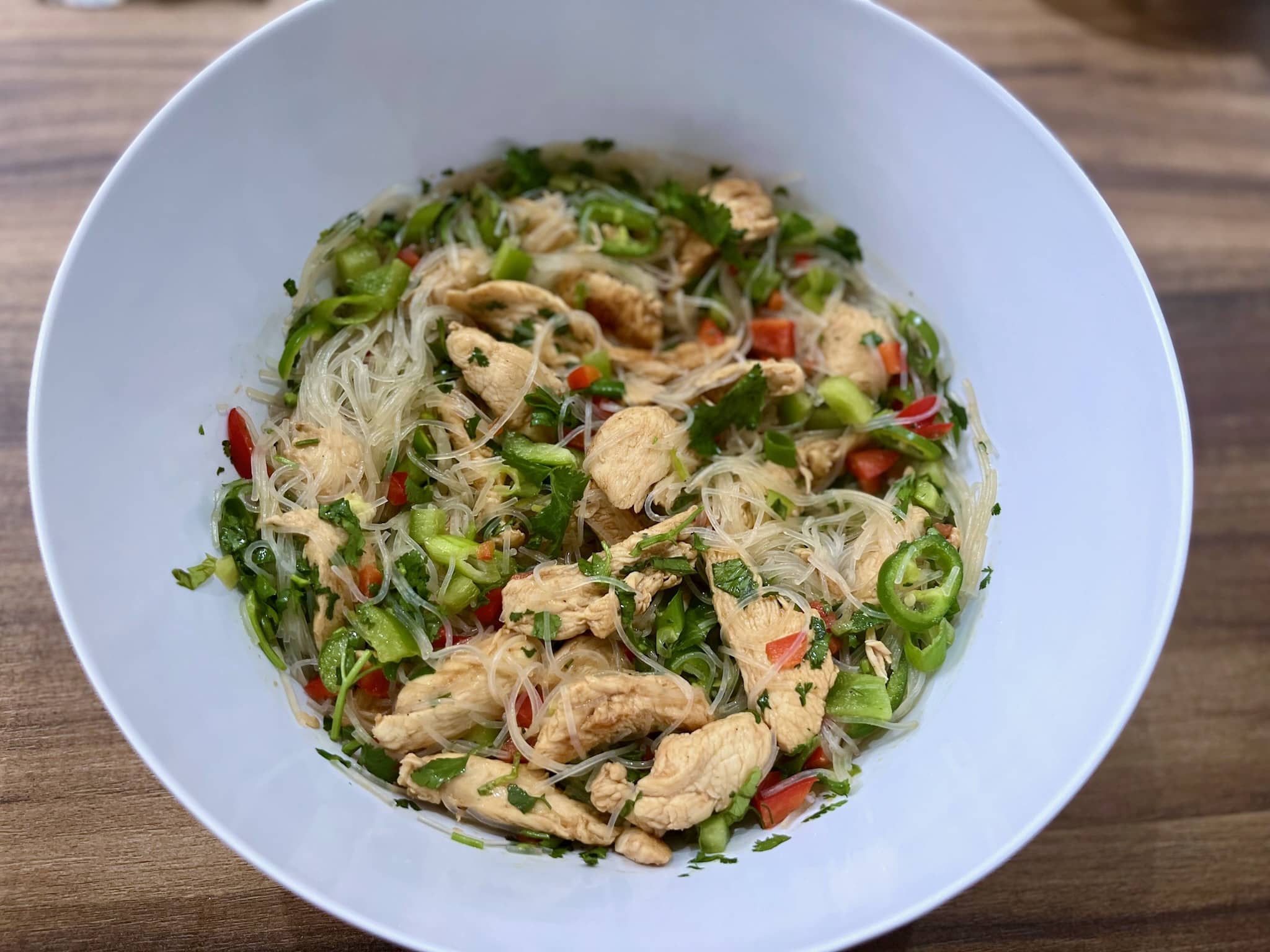 Noodles, chicken and vegetables mixed altogether