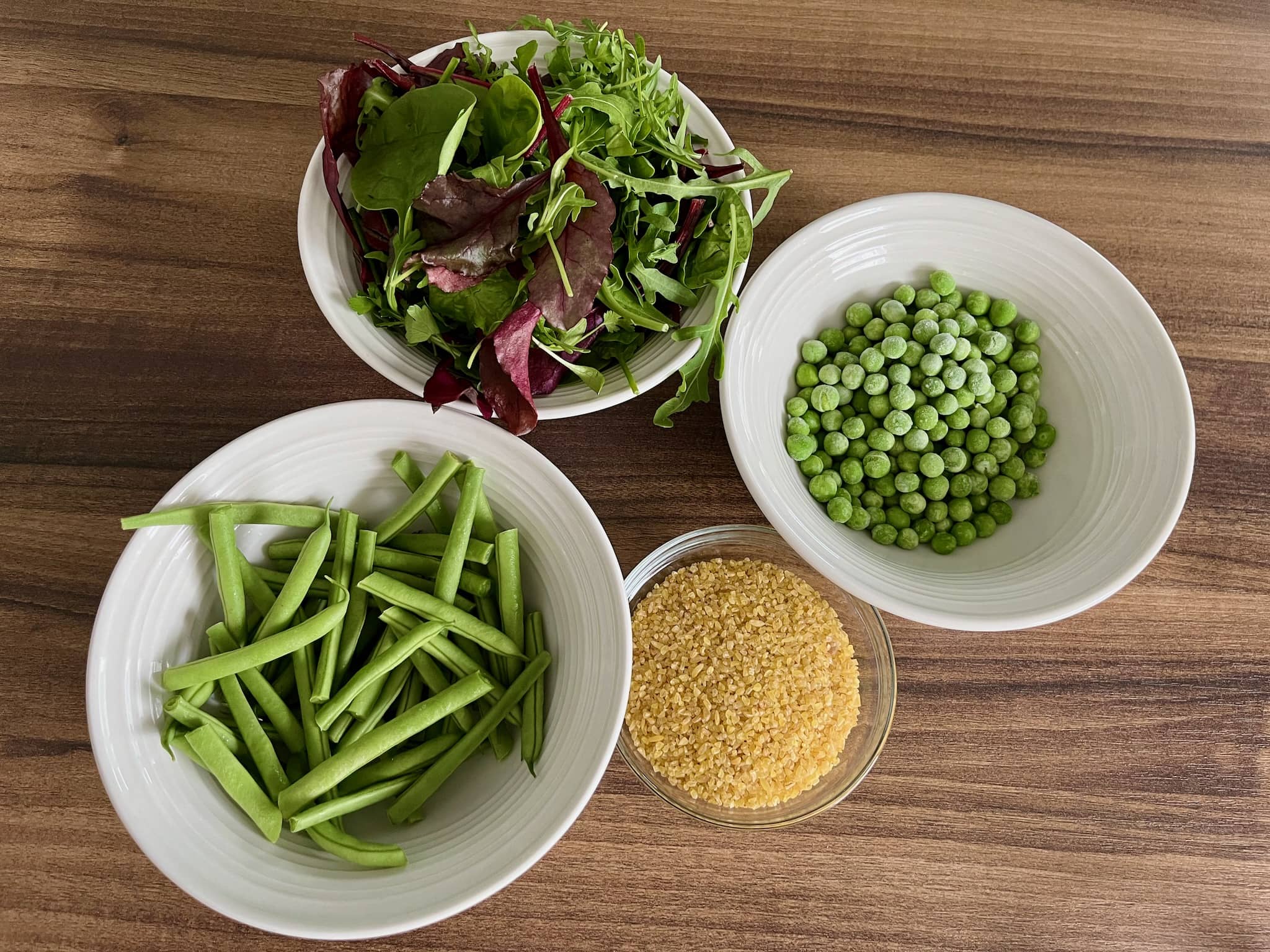 Main ingredients ready to use. Leaf salad, green beans, bulgur whear, garden peas