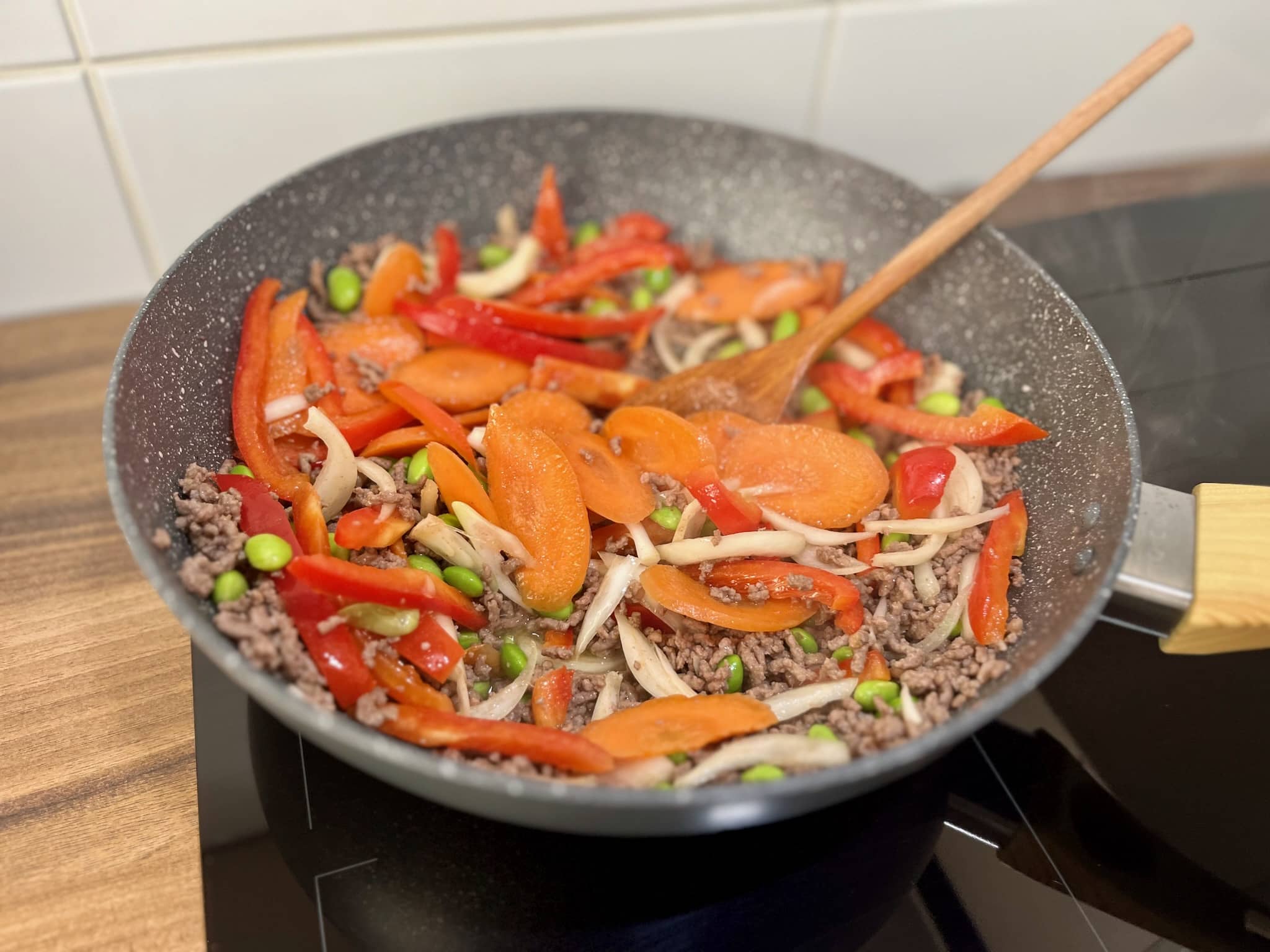 Well-stir-fried vegetables with ground beef in a pan