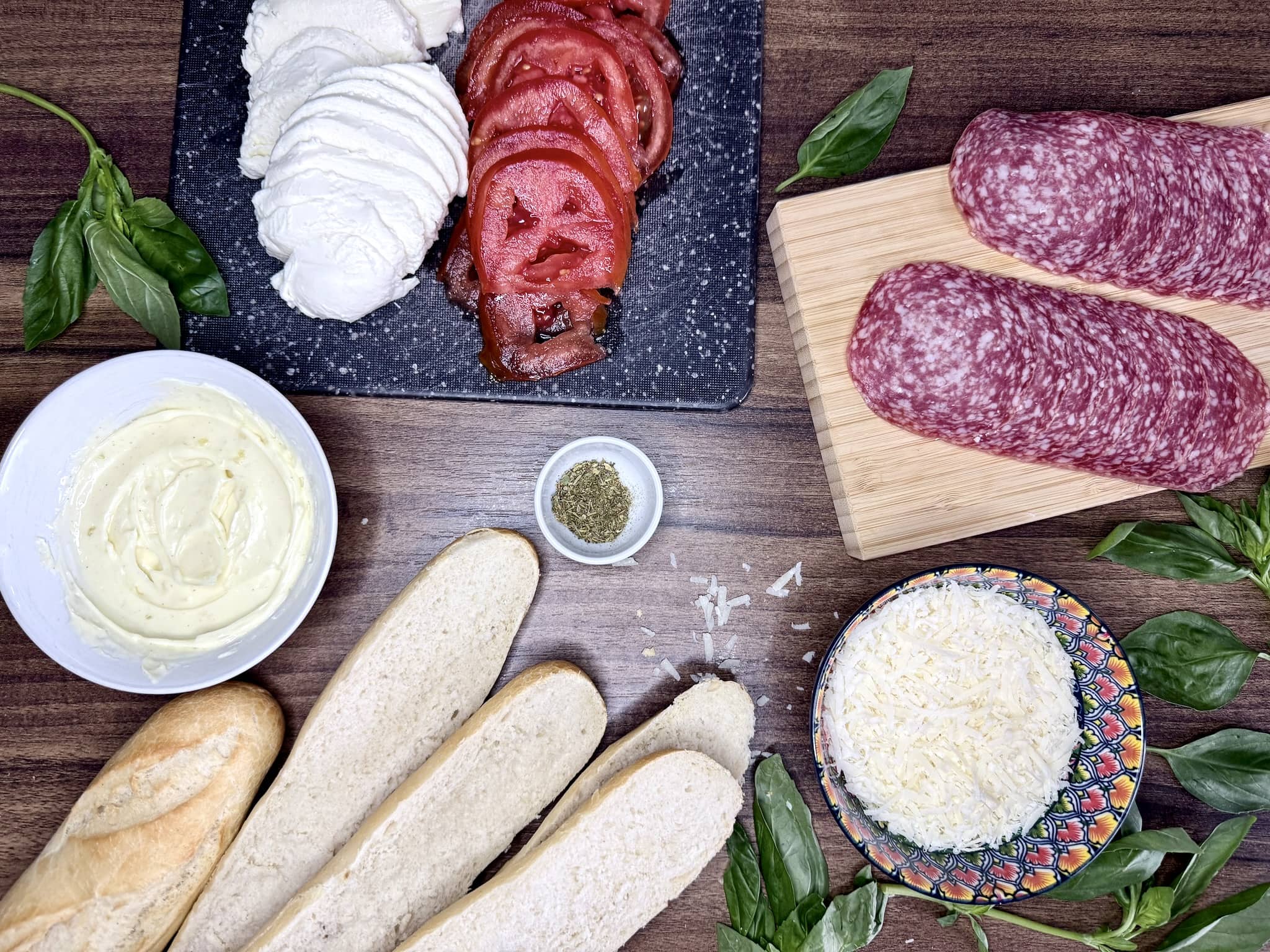 All the ingredients on the worktop ready to make Italian-style open-faced sandwiches