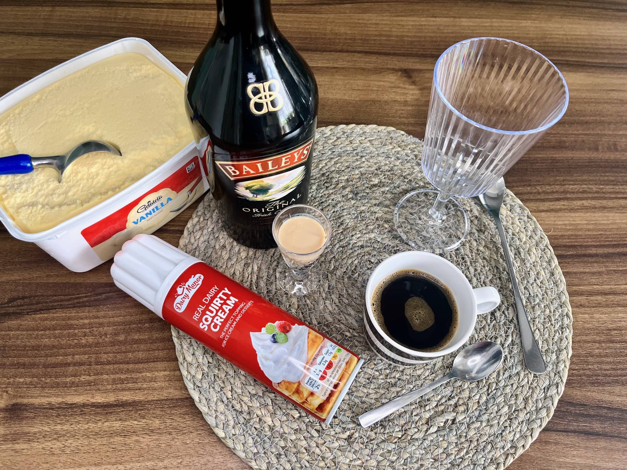 Ingredients on the tabletop, ready to make Baileys Iced Coffee