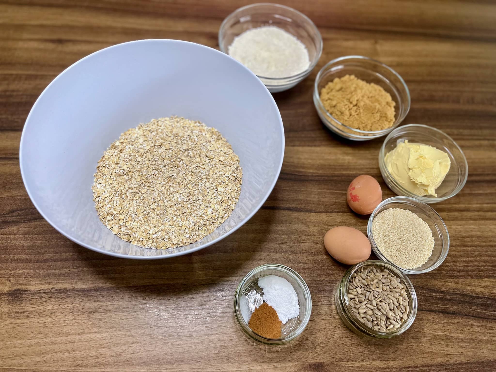 All the ingredients on the tabletop ready to make Just Perfect Seeded Oat Cookies