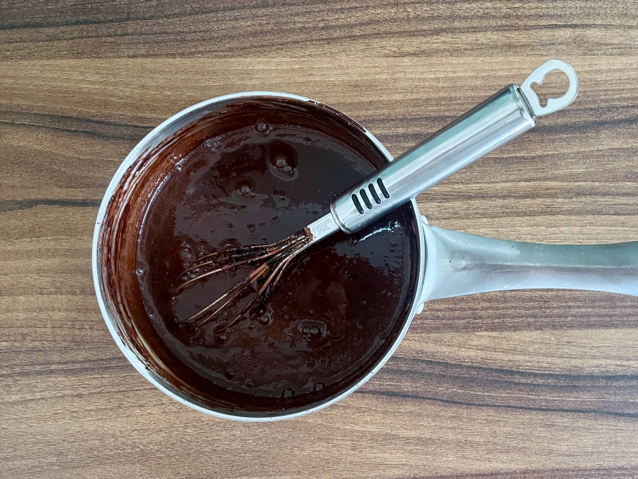 Chocolate sauce for Lamingtons ready in a pan