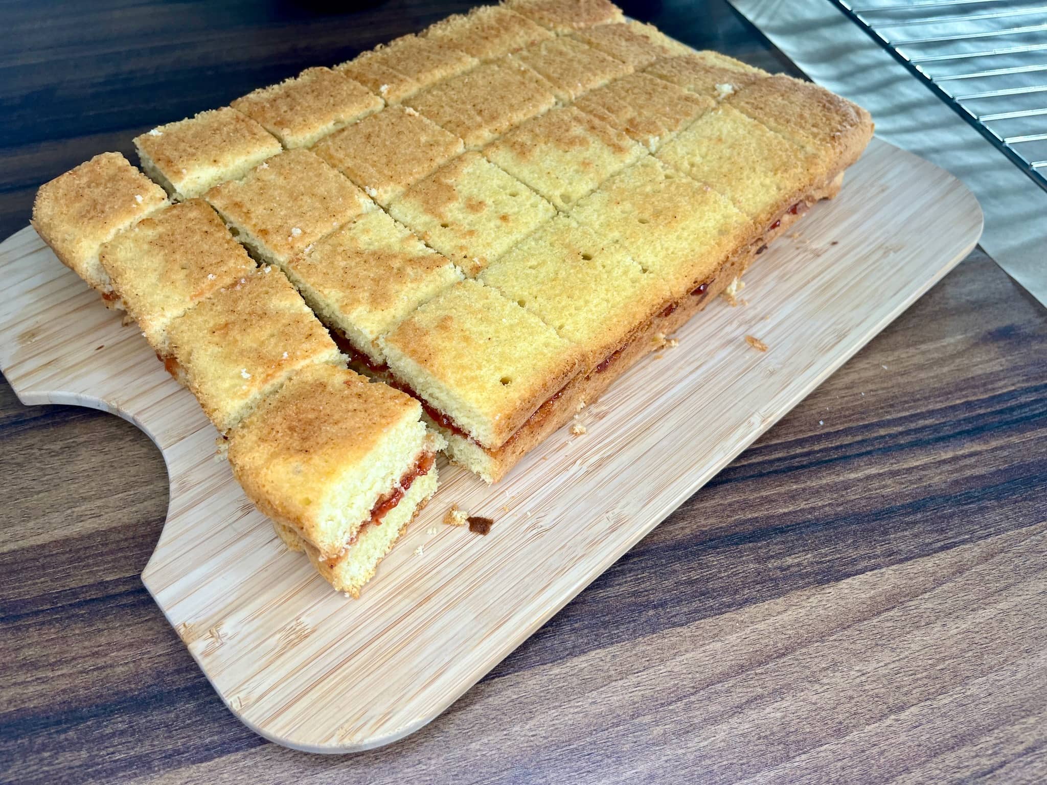 Sponge cakes for lamingtons cut into 24 square pieces
