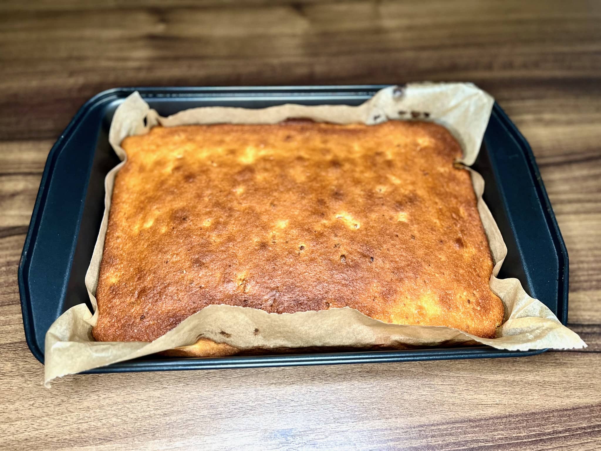 Nicely baked lemon cake cooling down in a baking tray