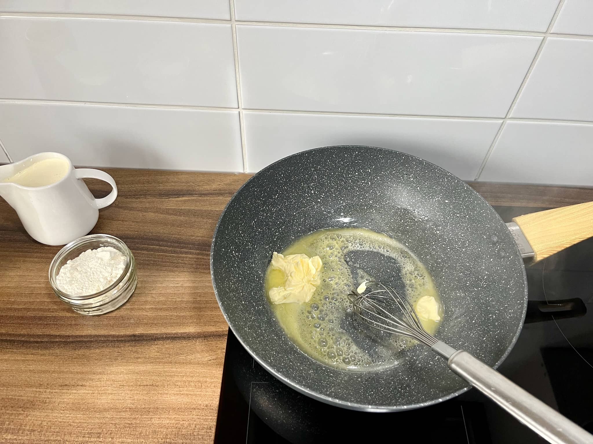 Melting butter in a pan before starting to make the sauce