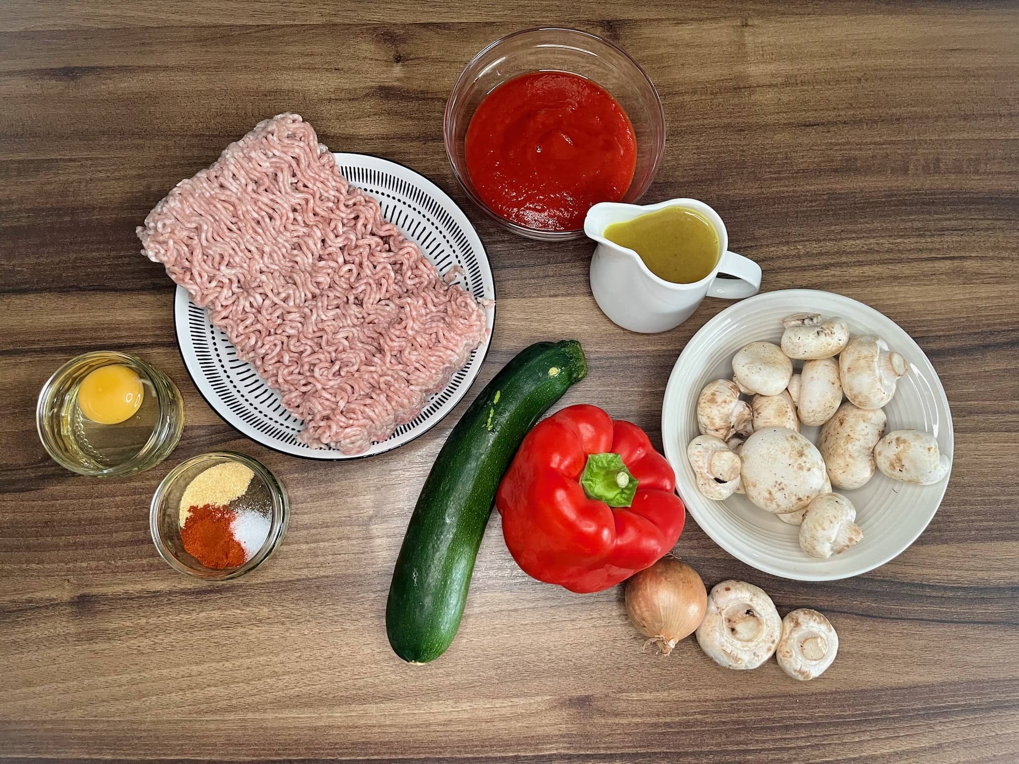 The ingredients for Meatballs in Vegetable Stew are all laid out on the table, ready to be cooked.