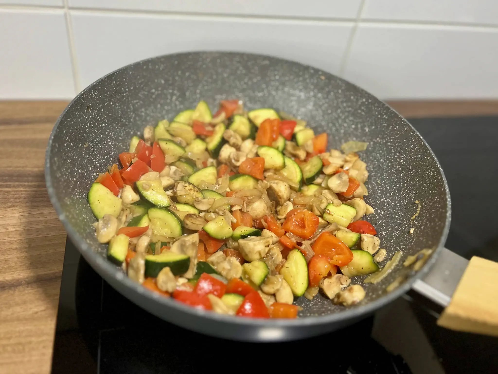 A pan of golden brown vegetables, cooked to perfection.