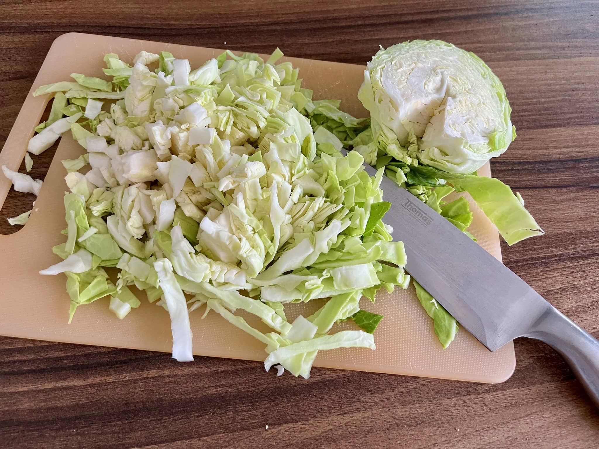 Chopped British sweetheart Cabbage on a chopping board