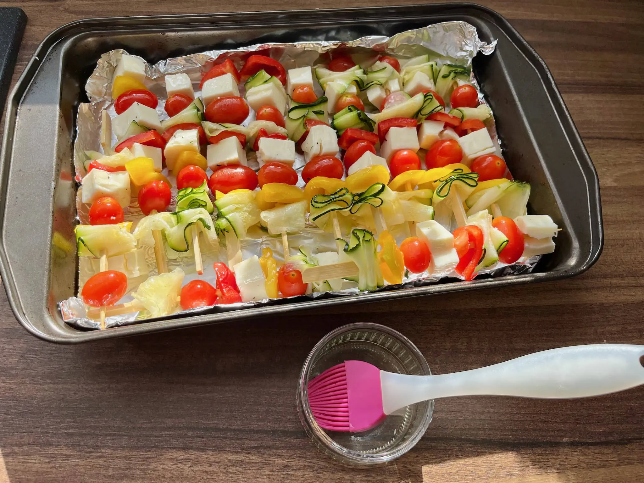 Meatless Skewers with Halloumi Cheese just before baking on a baking tray brushed with olive oil