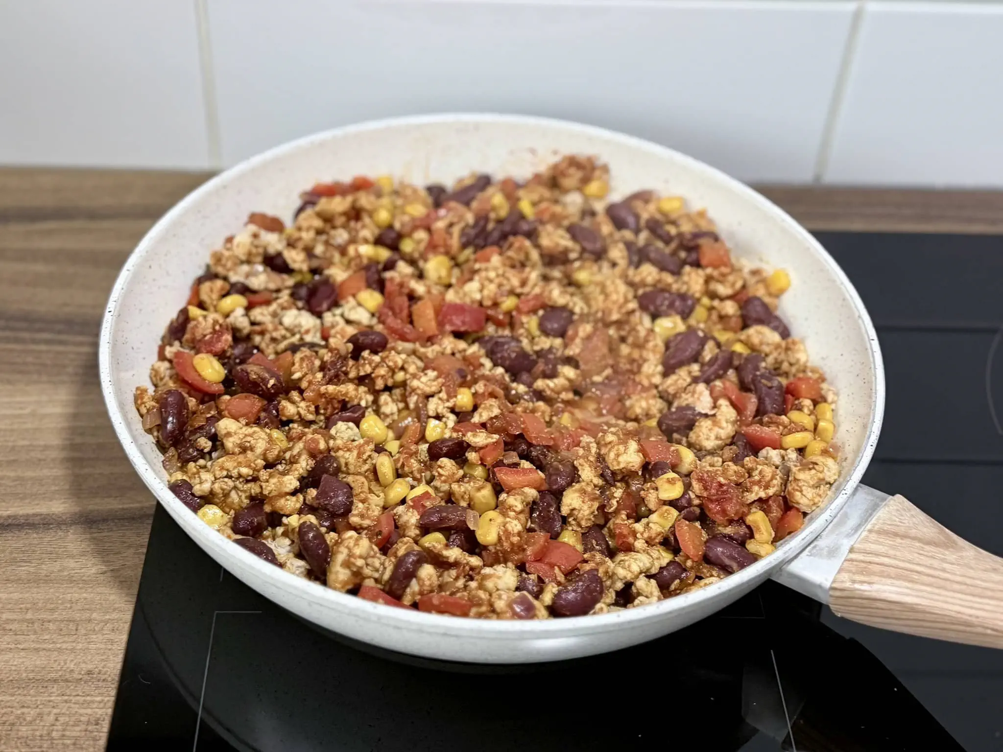 Taco seasoning added to the skillet