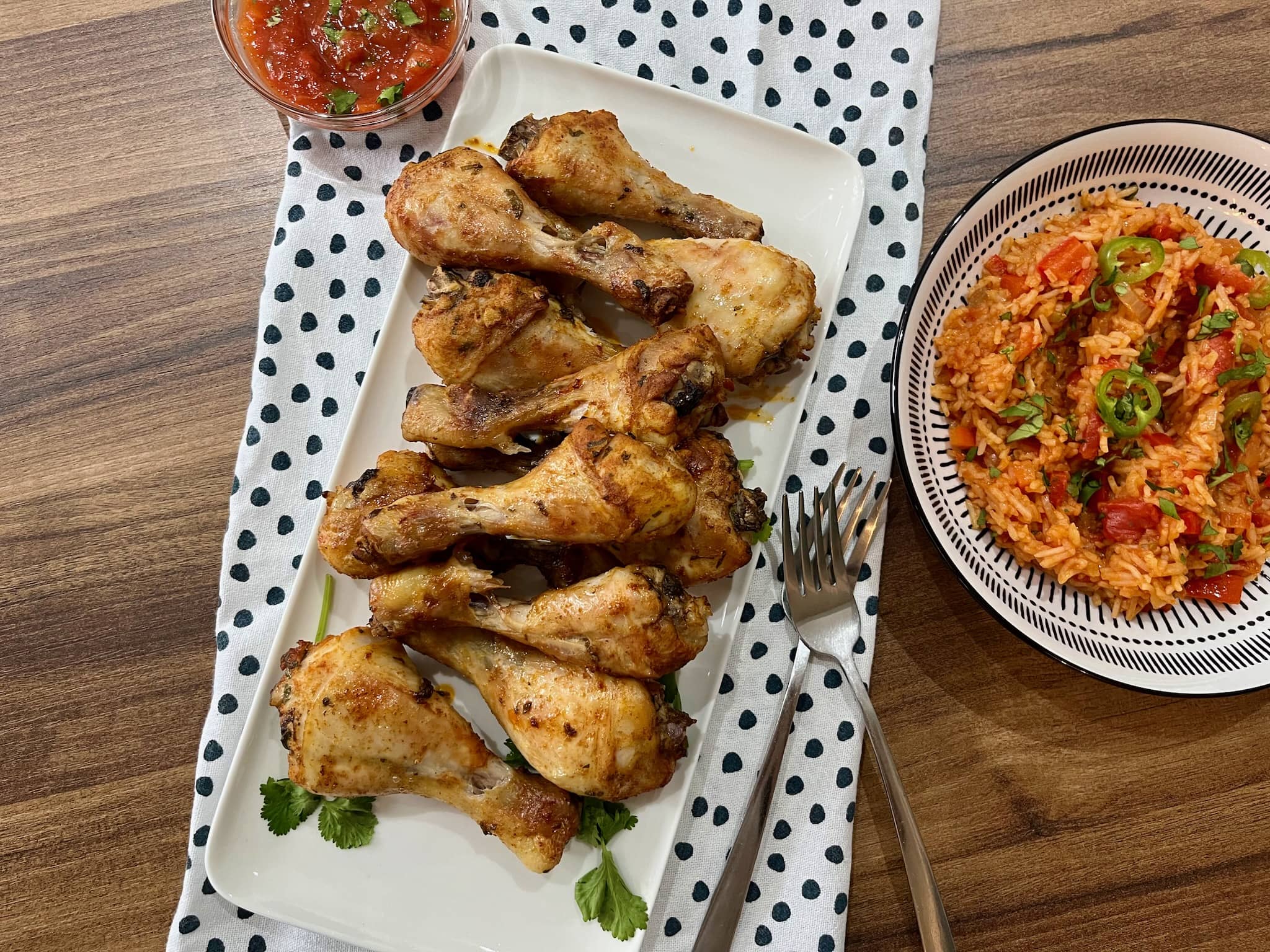Nicely baked Mexican-style chicken drumsticks on a plater