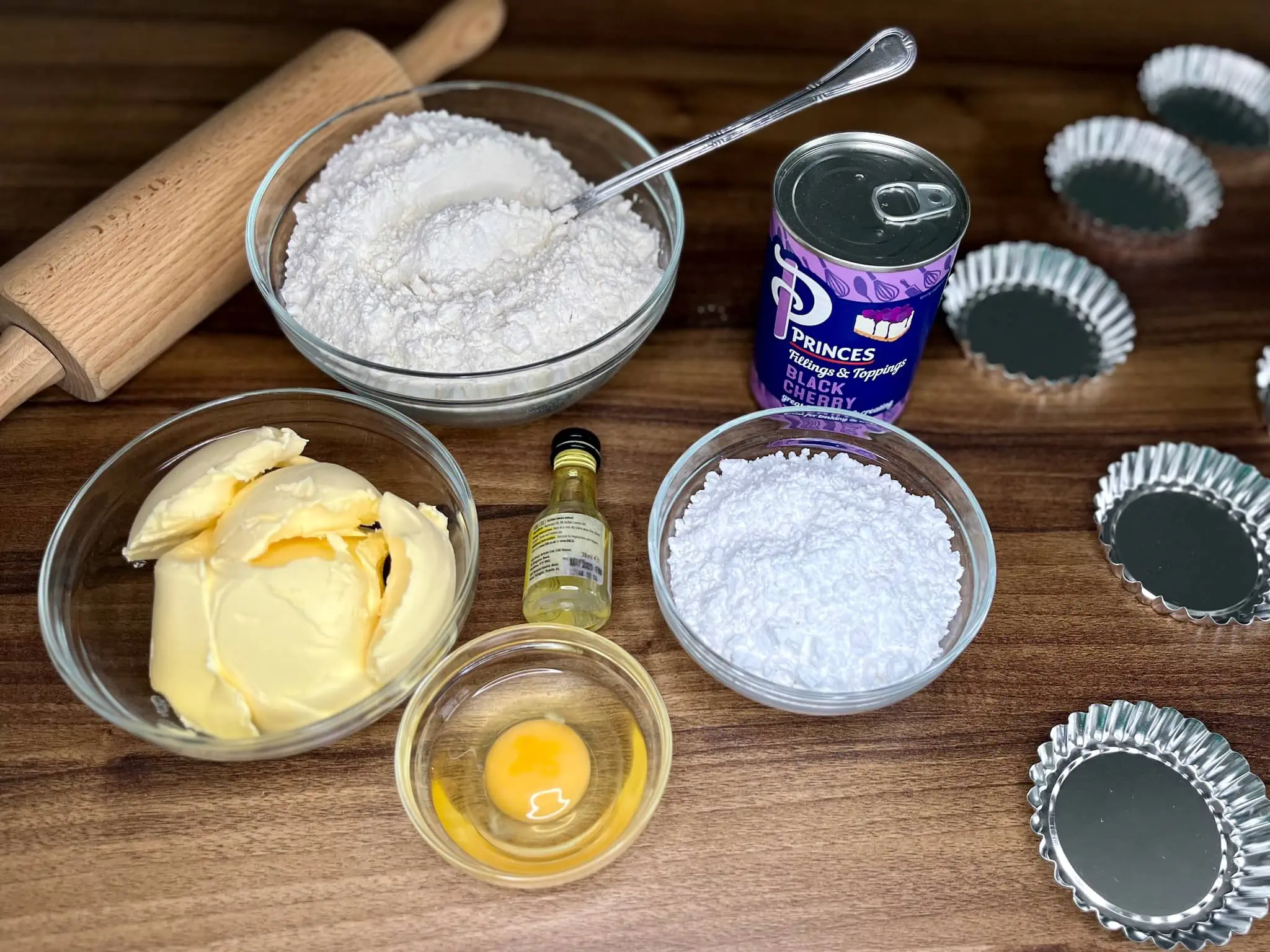 All the ingredients for Mini Cherry Tarts are on the tabletop and ready to use